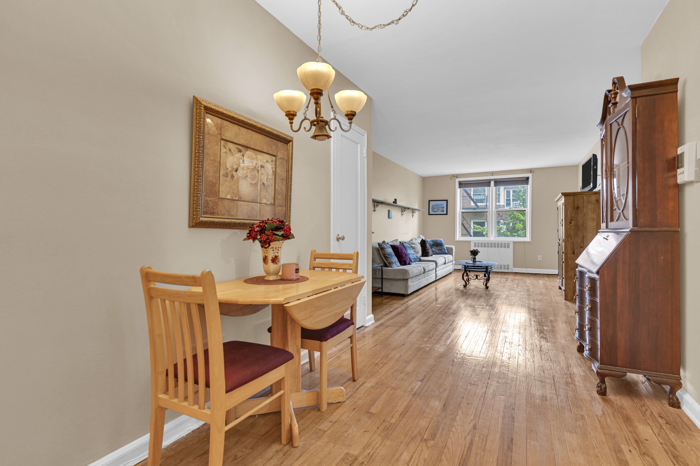 5614 Netherland Avenue, Unit 3E Bronx, NY 10471 - Photo 6 of 13 a living room that has a couch and a table in it