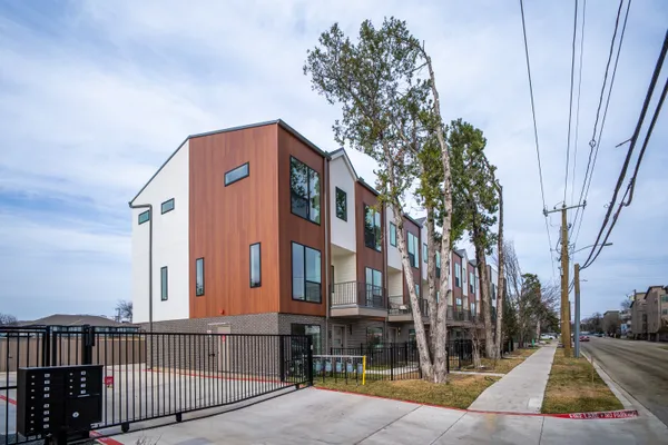 a view of multiple houses with a yard