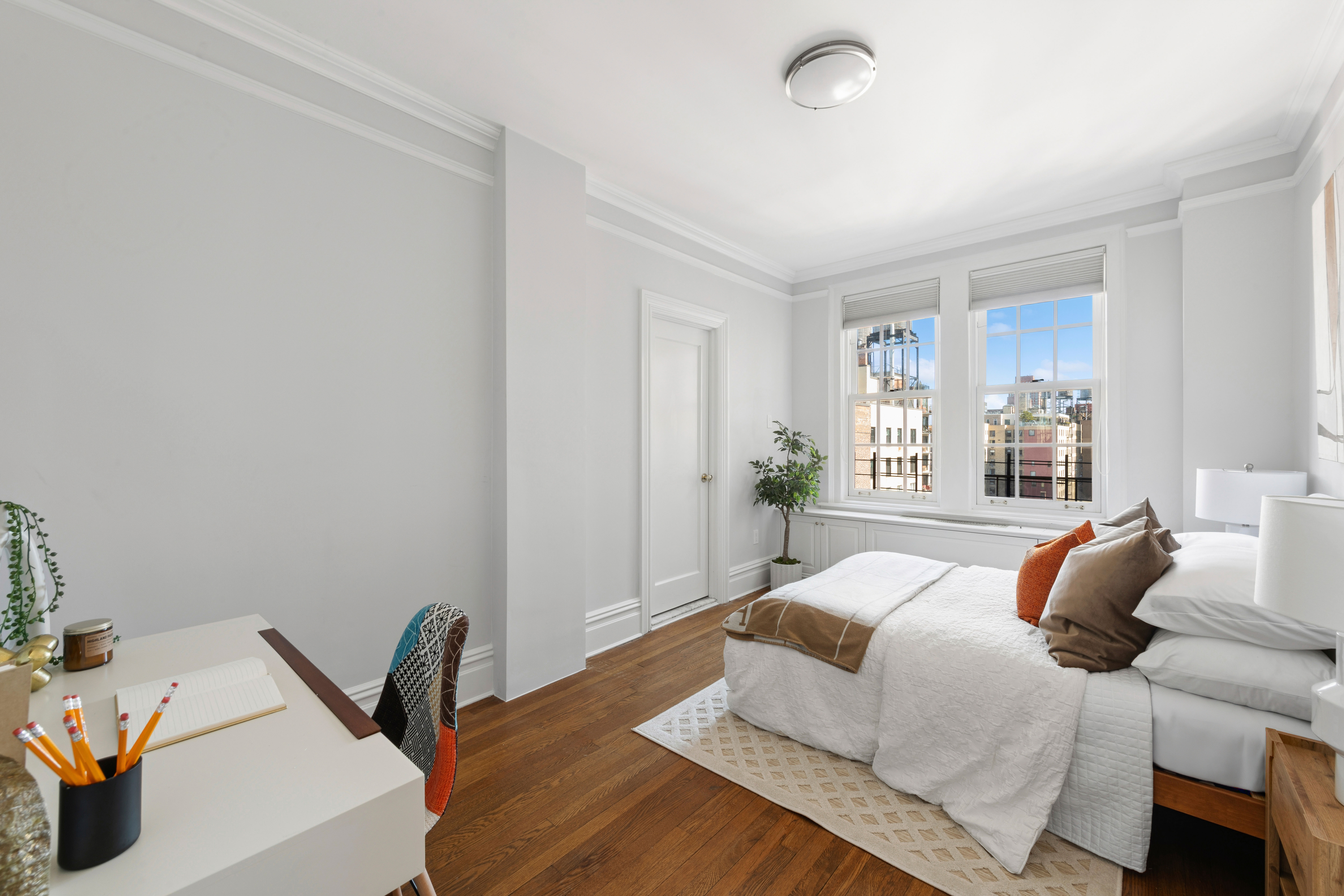 1140 5th Avenue, Unit 14B Manhattan, NY 10128 - Photo 9 of 18 a bedroom with a bed and window