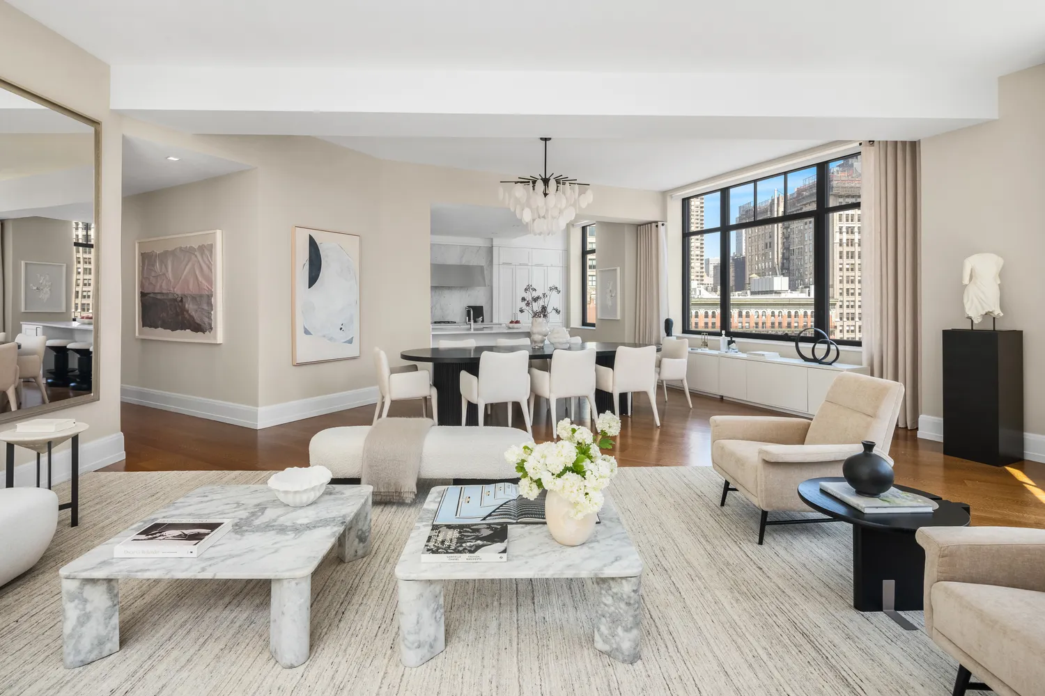 a living room with furniture dining table wooden floor and a large window