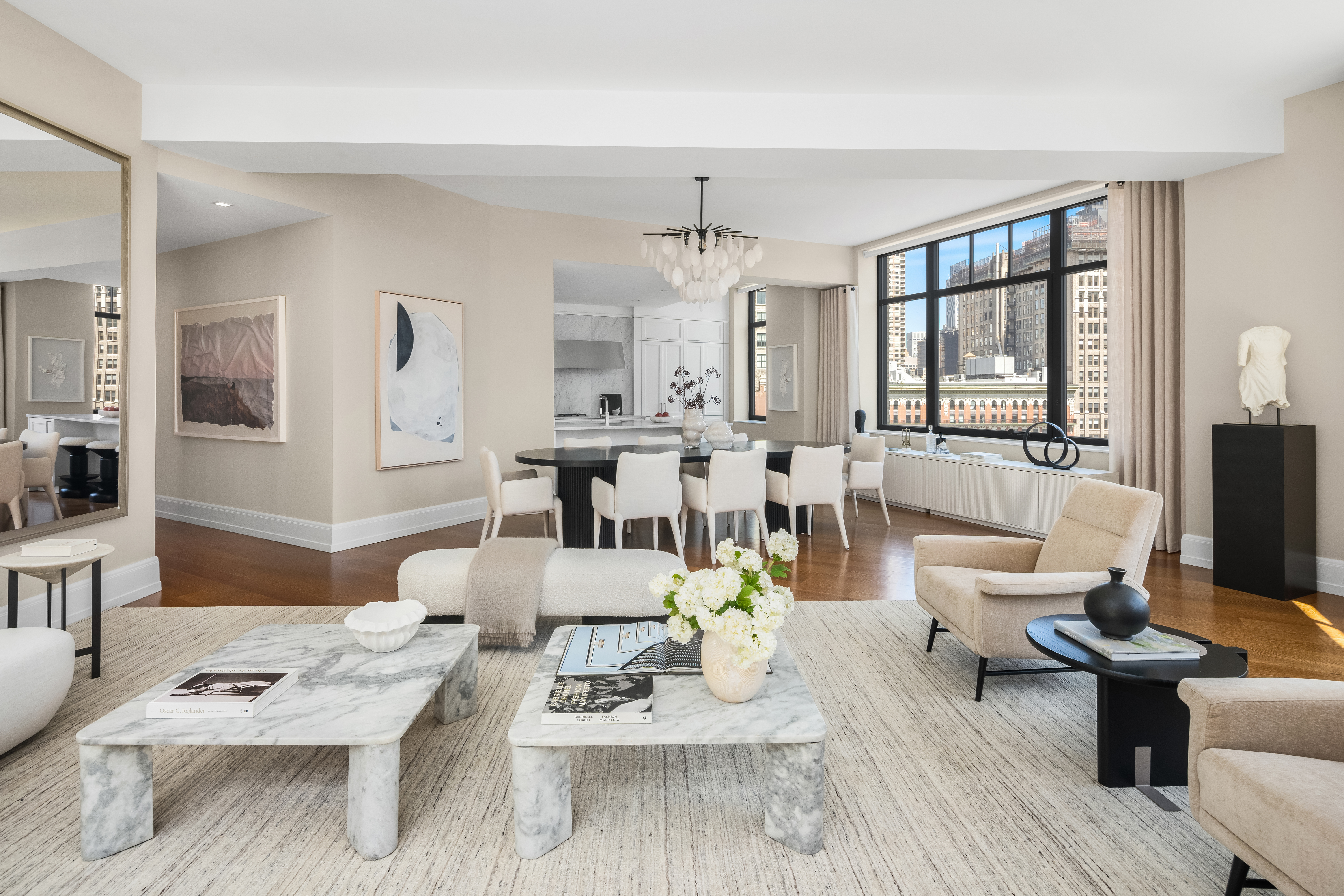 10 Madison Square West, Unit 12D Manhattan, NY 10010 - Photo 8 of 21 a living room with furniture dining table wooden floor and a large window