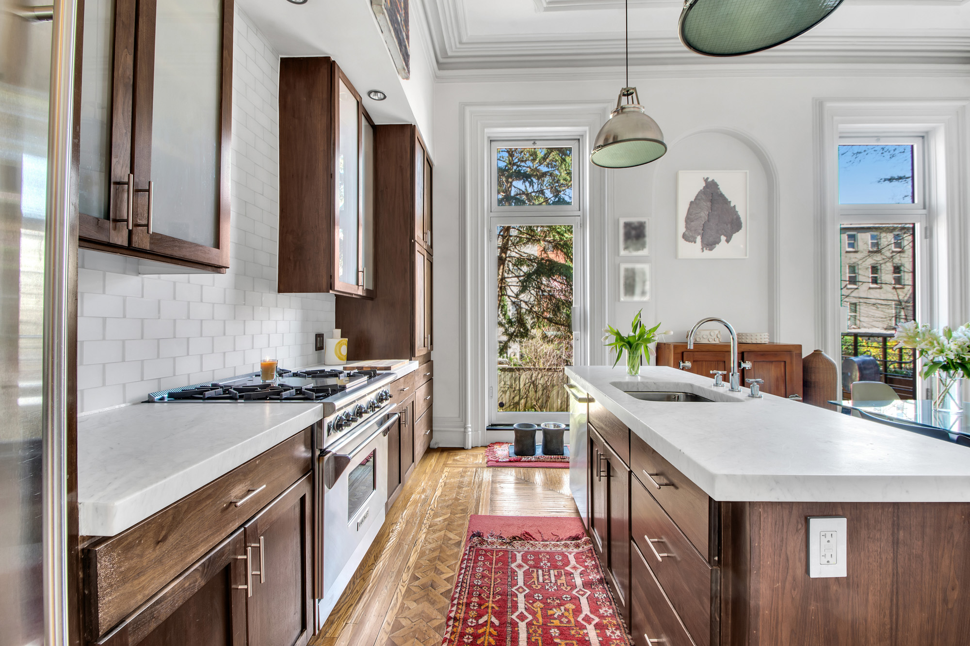 383 Grand Avenue Brooklyn, NY 11238 - Photo 3 of 32 a kitchen with stainless steel appliances granite countertop a stove a sink and a refrigerator
