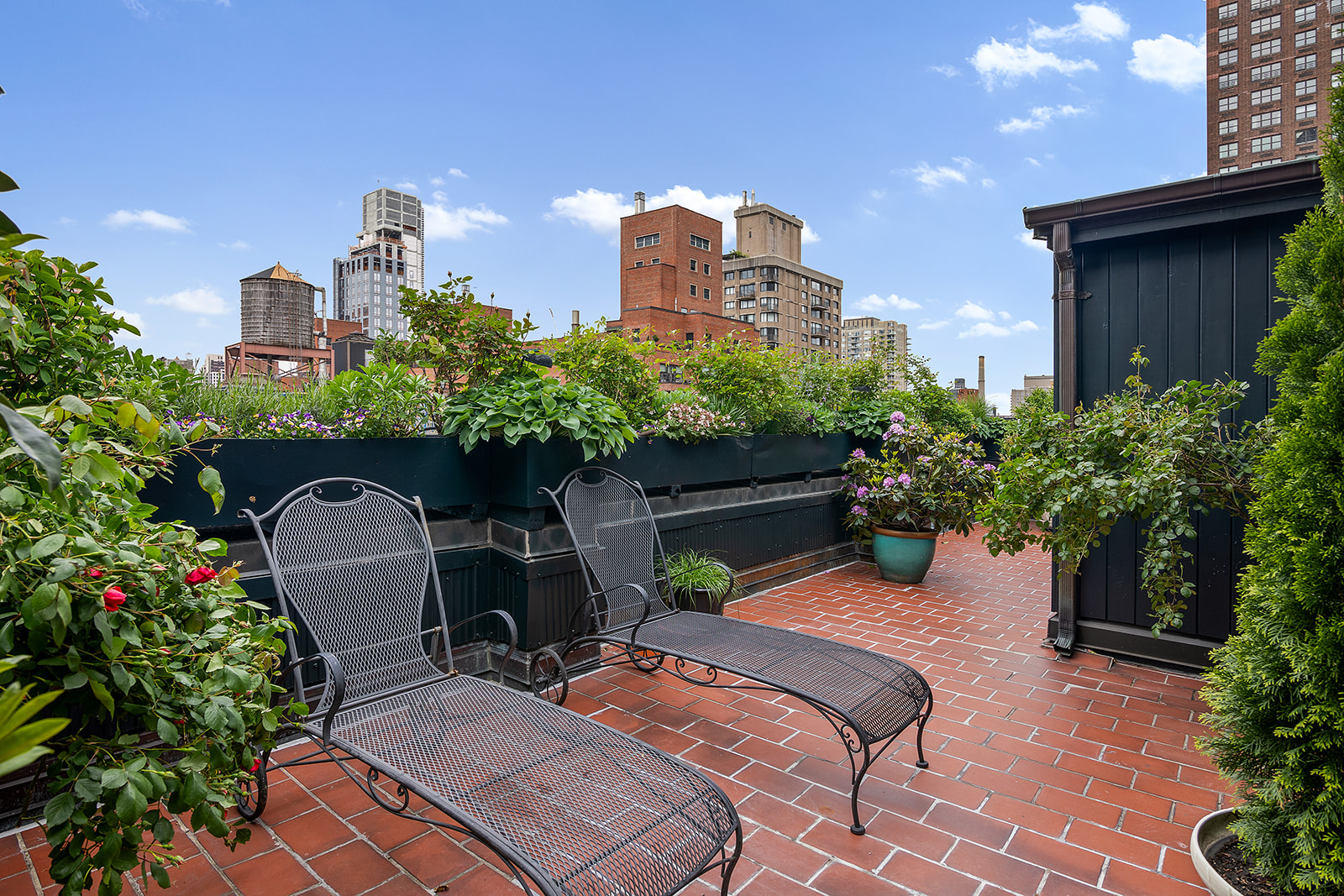 164 East 72nd Street, Unit PHC Manhattan, NY 10021 - Photo 15 of 17 a backyard of a house with a yard and outdoor seating