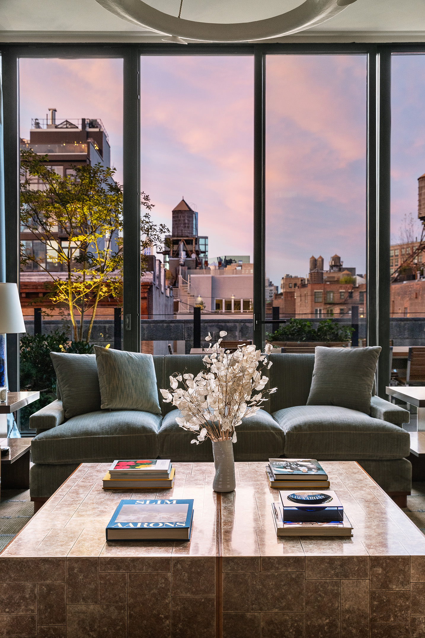 25 Bond Street, Unit PHW Manhattan, NY 10012 - Photo 8 of 34 a living room with furniture large windows and a table