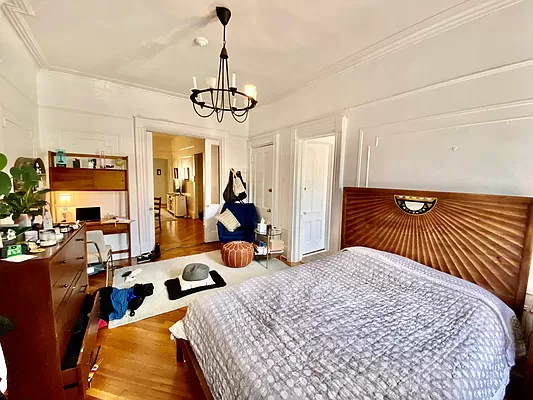 351 7th Avenue, Unit 2 Brooklyn, NY 11215 - Photo 3 of 10 a bedroom with a bed and ceiling fan