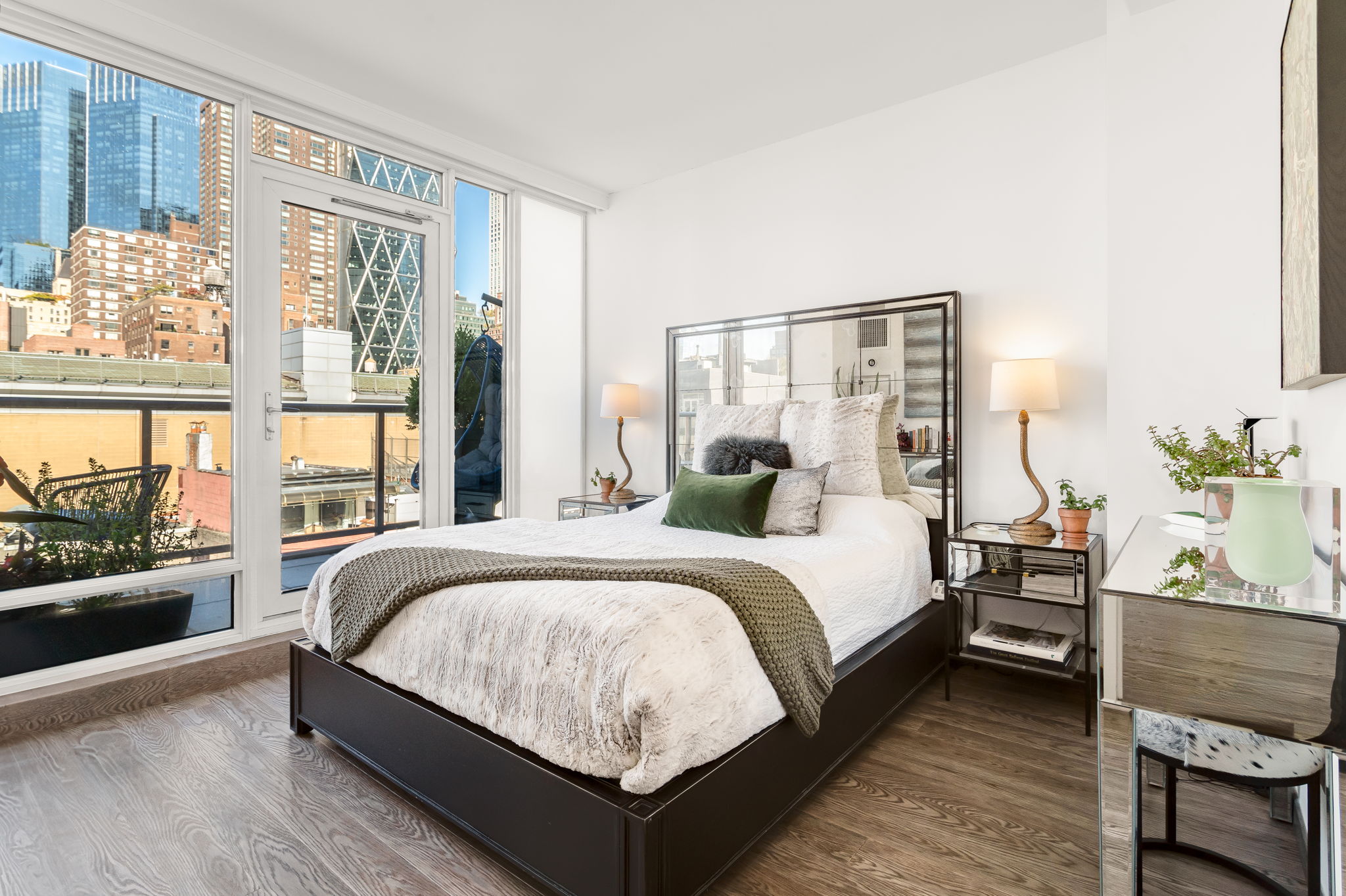 350 West 53rd Street, Unit PHB Manhattan, NY 10019 - Photo 15 of 34 a bedroom with a large bed and a large window