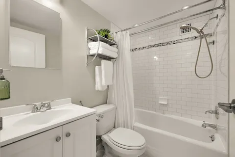 a bathroom with a sink a mirror and a shower