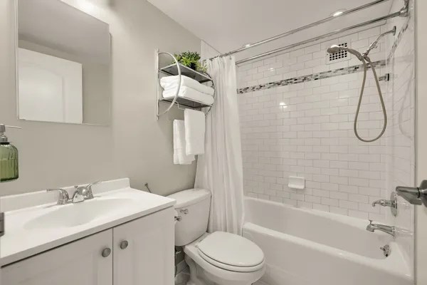 a bathroom with a sink a mirror and a shower