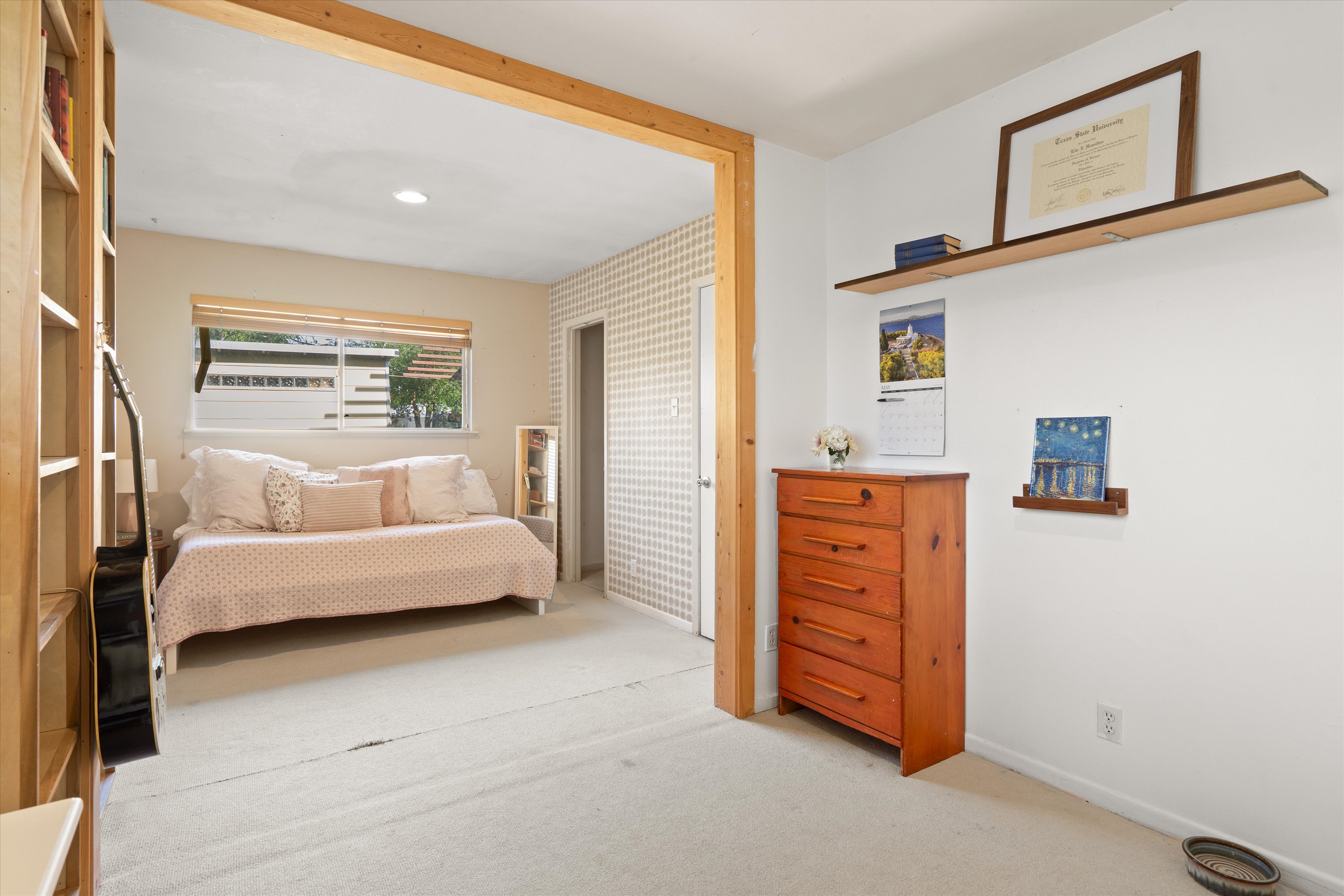4614 Jinx Avenue Austin, TX 78745 - Photo 16 of 40 a bedroom with a bed and furniture