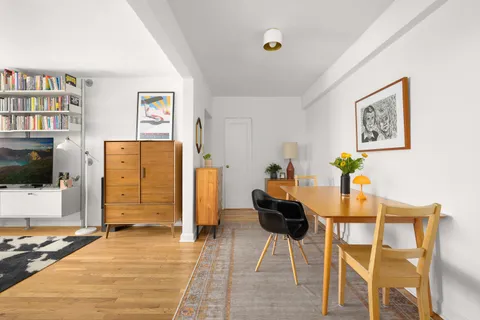 a view of a livingroom with furniture and a flat screen tv