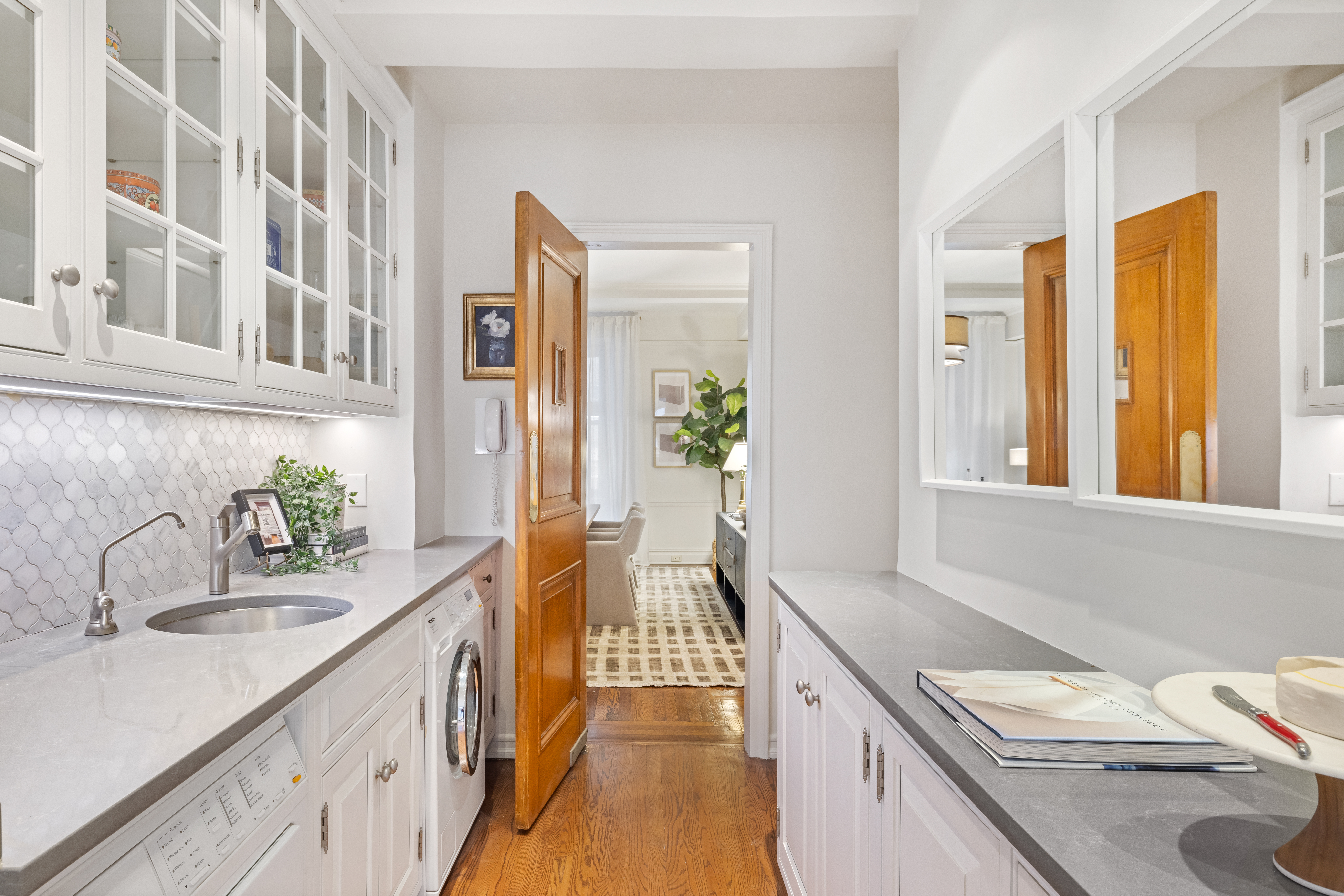 320 East 72nd Street, Unit 5B Manhattan, NY 10021 - Photo 5 of 18 a kitchen with a sink stove and cabinets