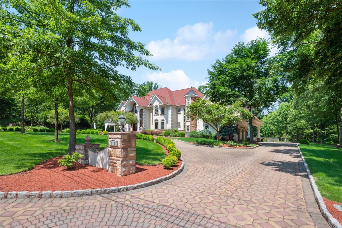 115 Skyline Drive Watchung, NJ 07069 - Photo 4 of 95 a front view of a house with a yard garden and outdoor seating