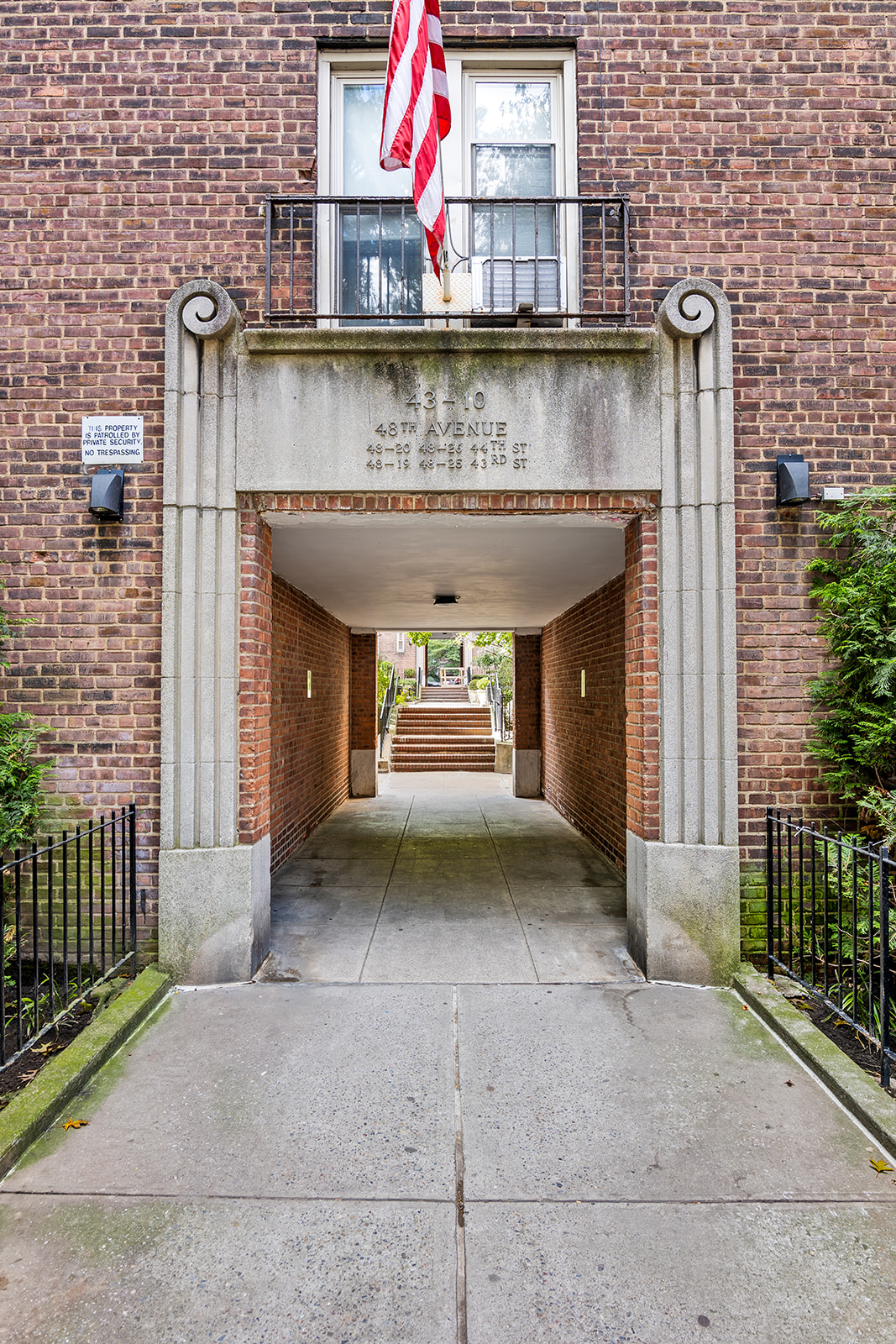 48-19 43rd Street, Unit 4A Queens, NY 11377 - Photo 7 of 8 a front view of a house with a garage