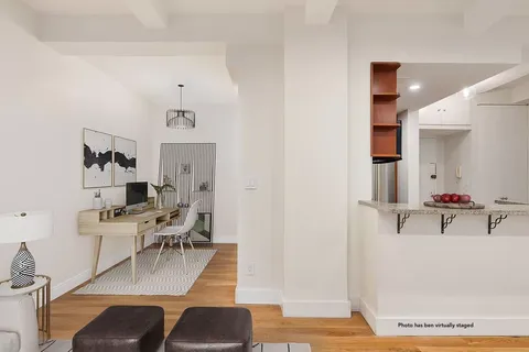 a view of a livingroom with furniture and wooden floor