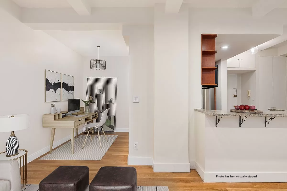 66 Madison Avenue, Unit 3BC Manhattan, NY 10016 - Photo 3 of 8 a view of a livingroom with furniture and wooden floor