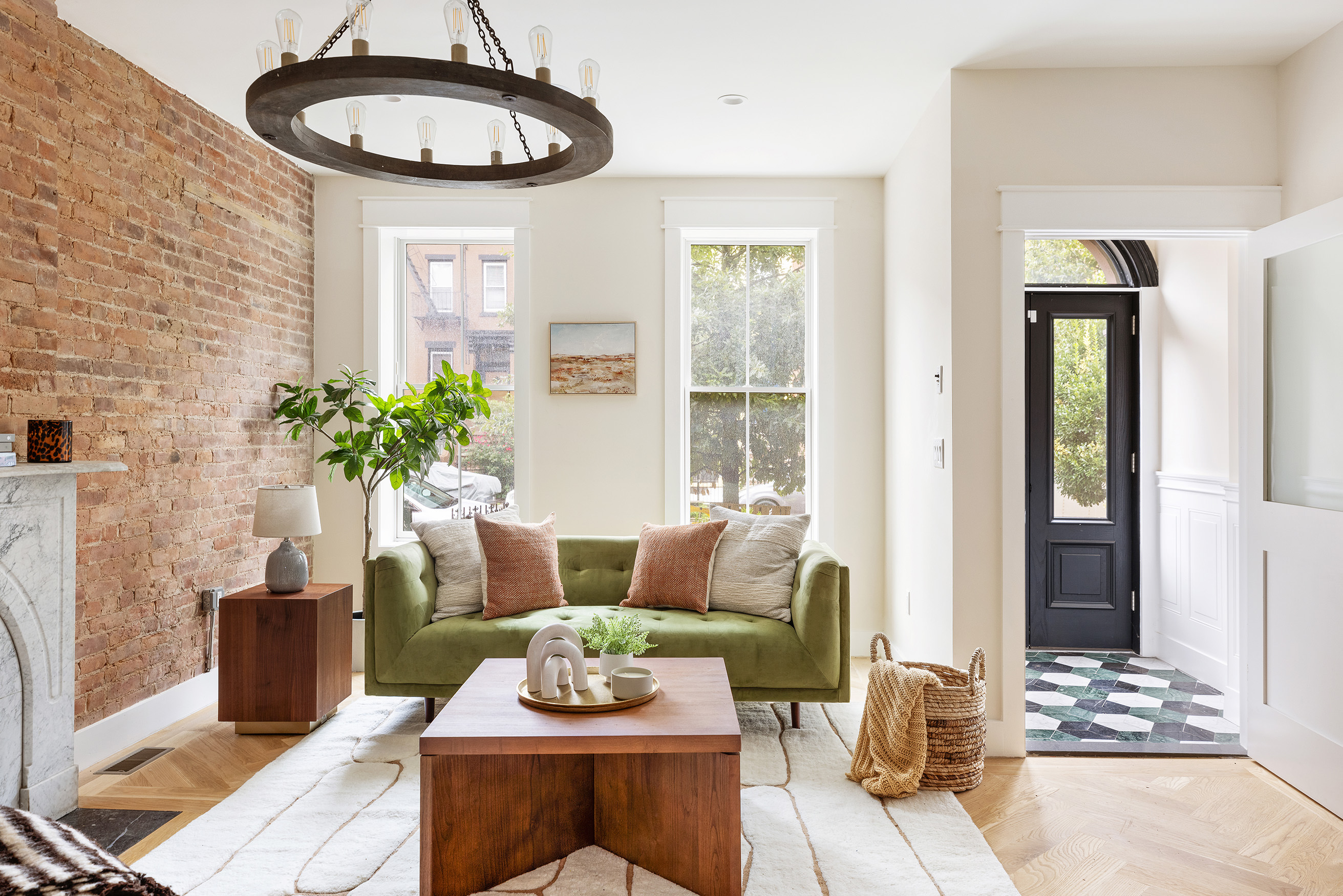 167 Putnam Avenue, Unit MF Brooklyn, NY 11216 - Photo 1 of 19 a living room with furniture a potted plant and a table