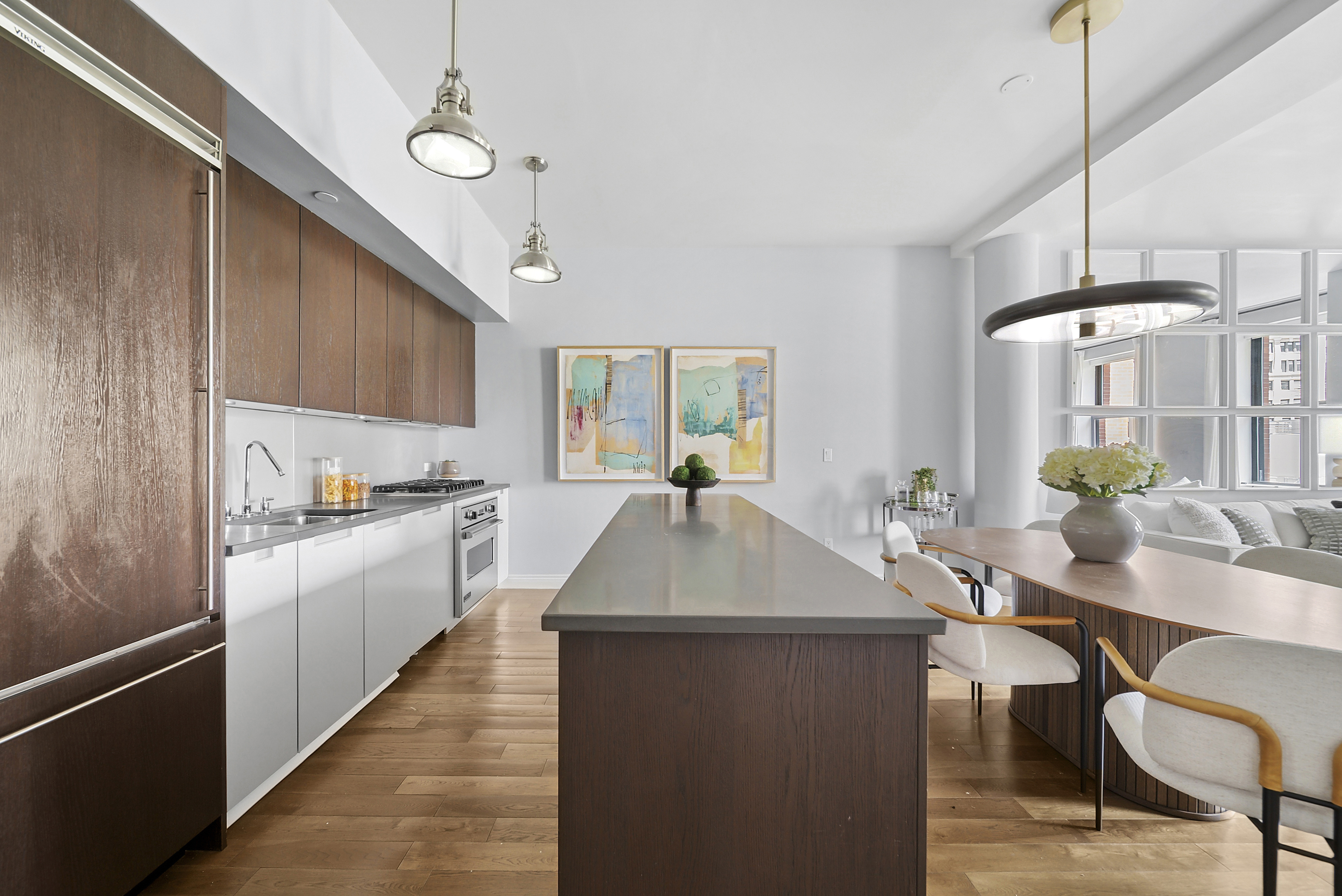 225 5th Avenue, Unit 7K Manhattan, NY 10010 - Photo 5 of 15 a kitchen with sink table and chairs
