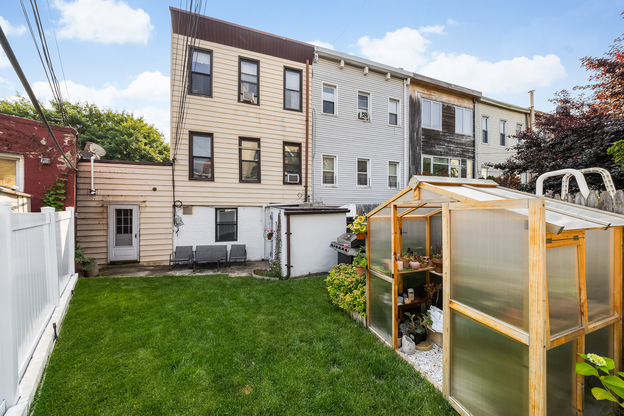 18 Russell Street Brooklyn, NY 11222 - Photo 11 of 24 a view of a house with a yard and sitting area