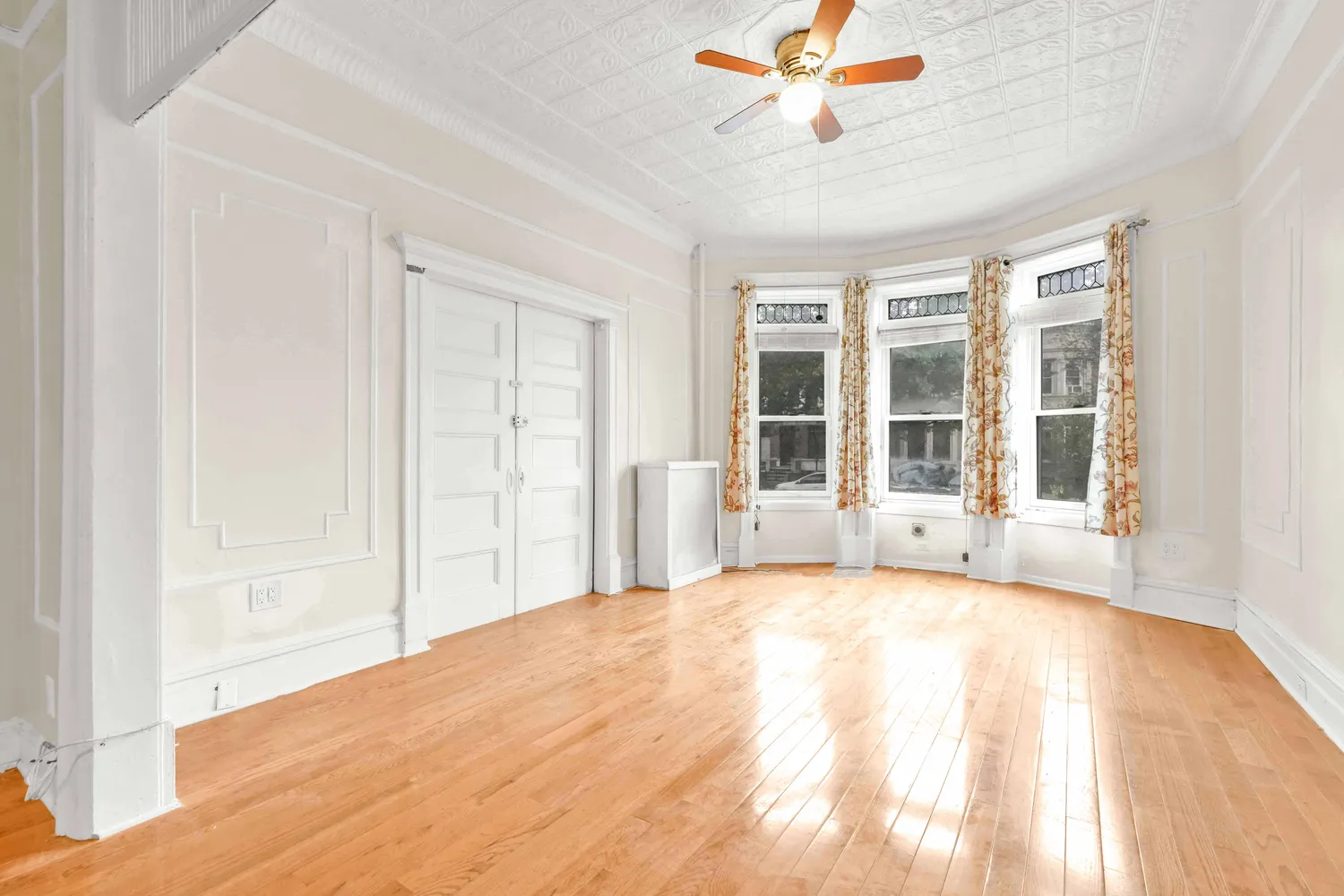 a view of a dining room with furniture and window