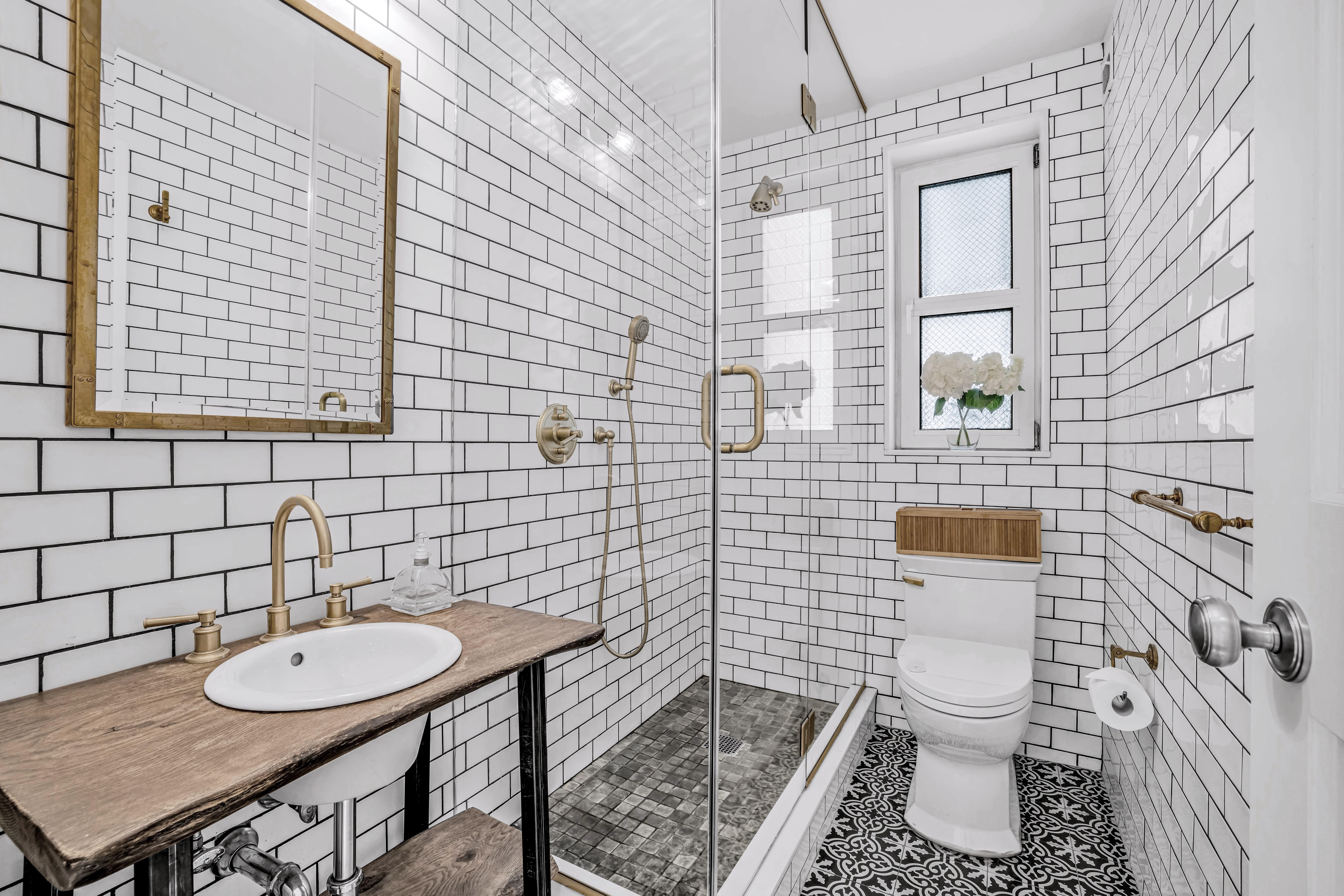 120 East 79th Street, Unit 7BC Manhattan, NY 10075 - Photo 8 of 12 a bathroom with a toilet a sink and mirror