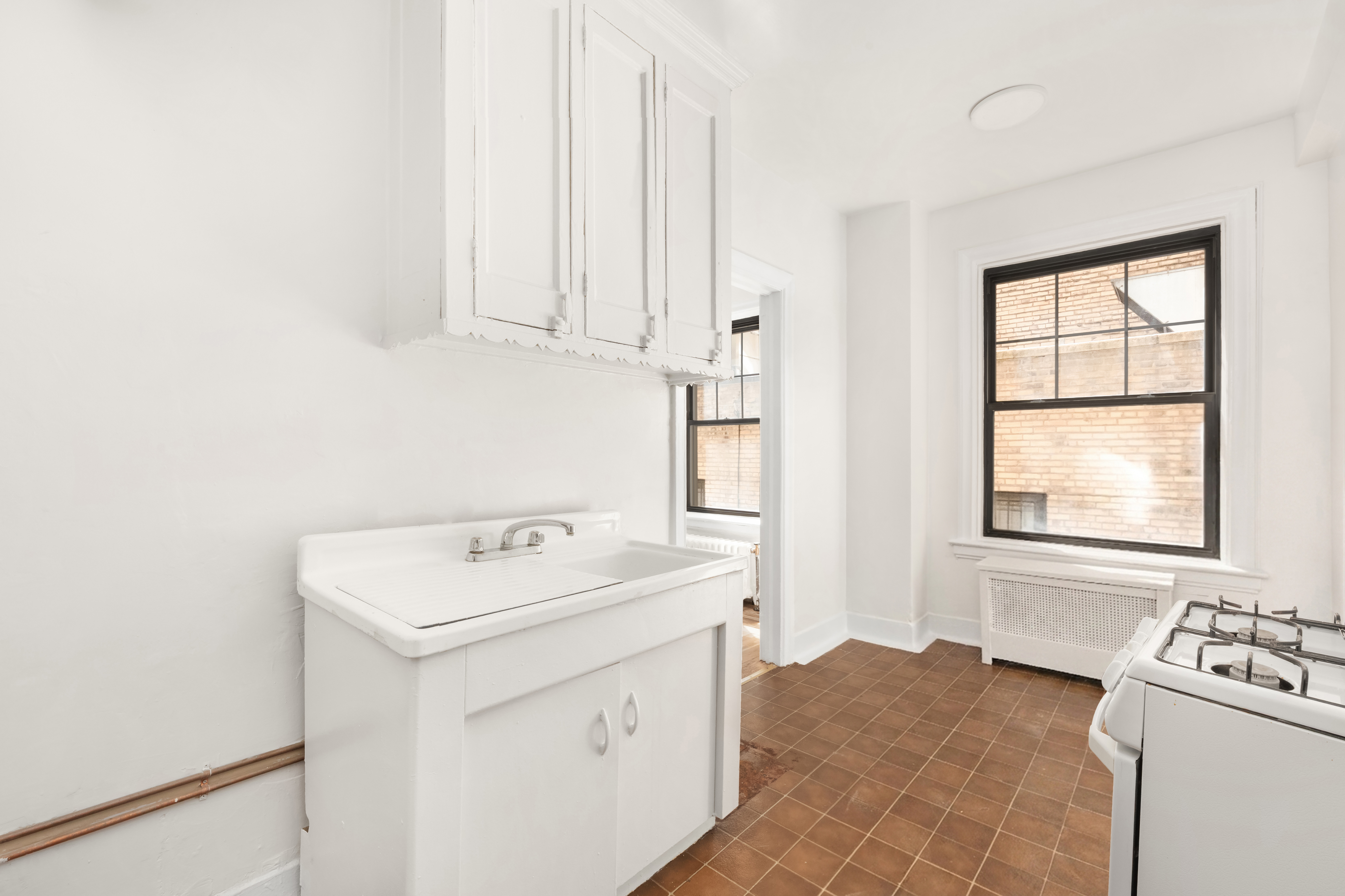 170 2nd Avenue, Unit 3E Manhattan, NY 10003 - Photo 6 of 12 a utility room with dryer and washer