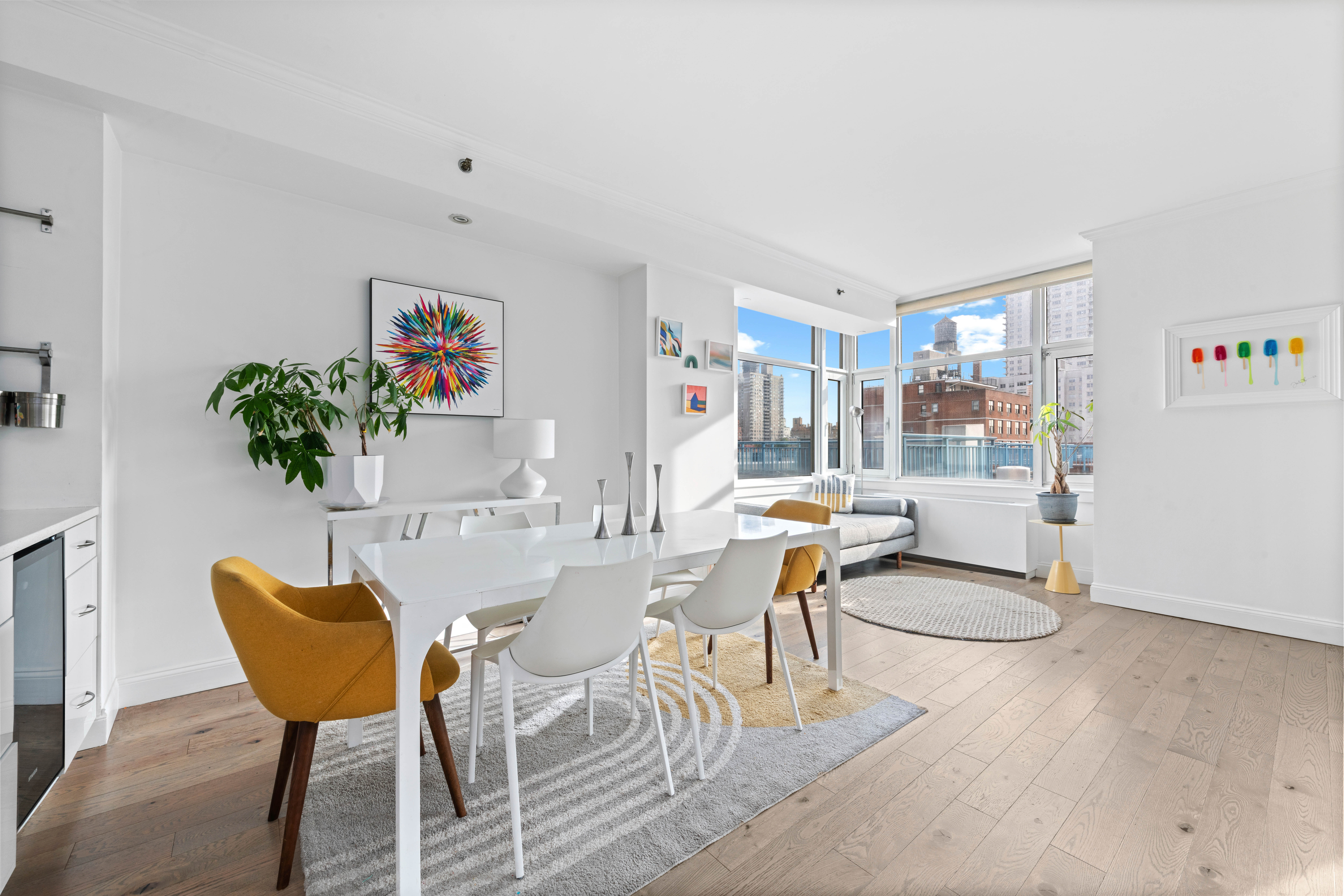 404 East 76th Street, Unit 8A Manhattan, NY 10021 - Photo 2 of 17 a dining room with furniture and wooden floor