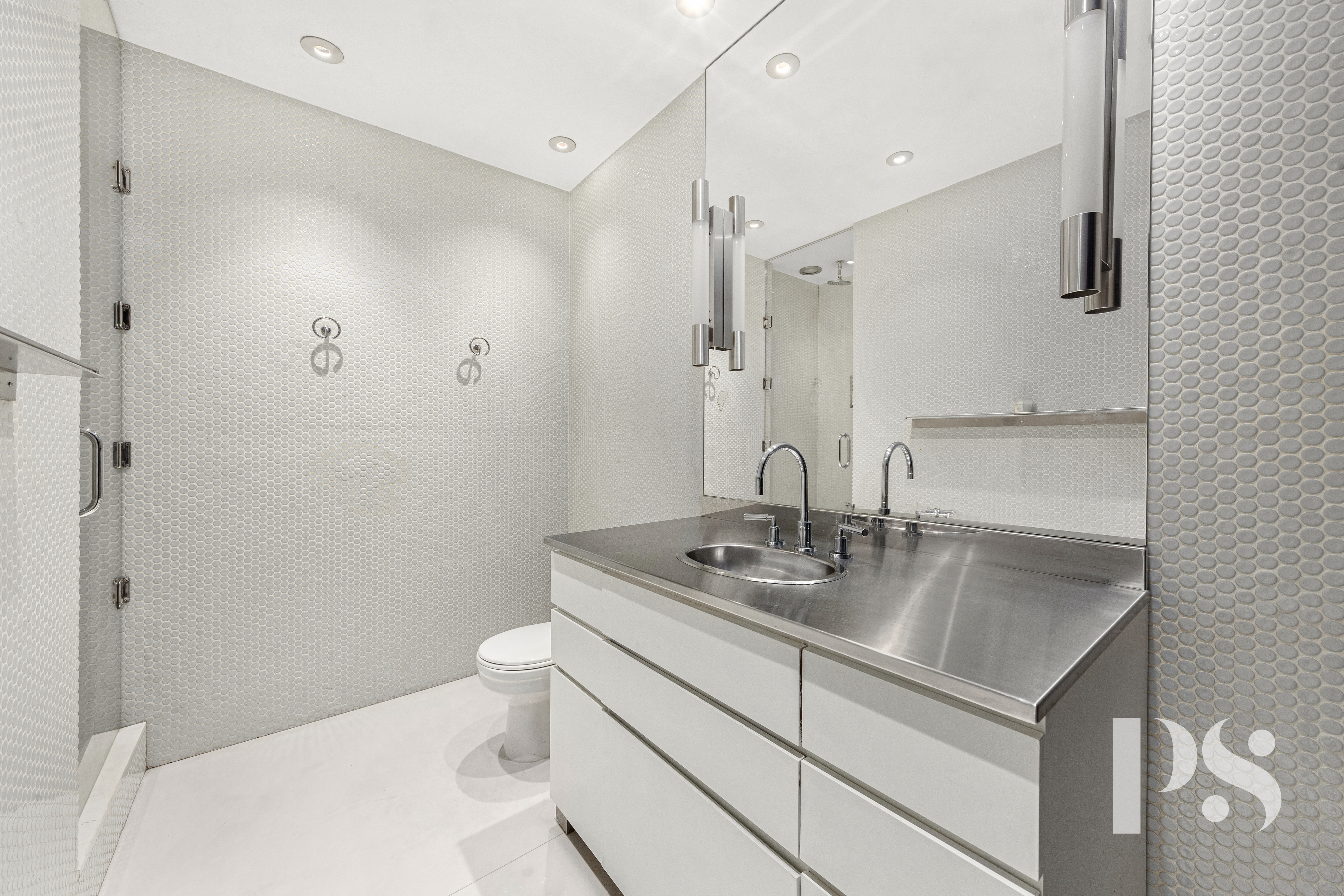 71-73 Bleecker Street, Unit 2E Manhattan, NY 10012 - Photo 13 of 18 a bathroom with a sink toilet and shower