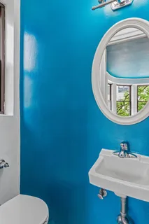 a bathroom with a toilet and a sink