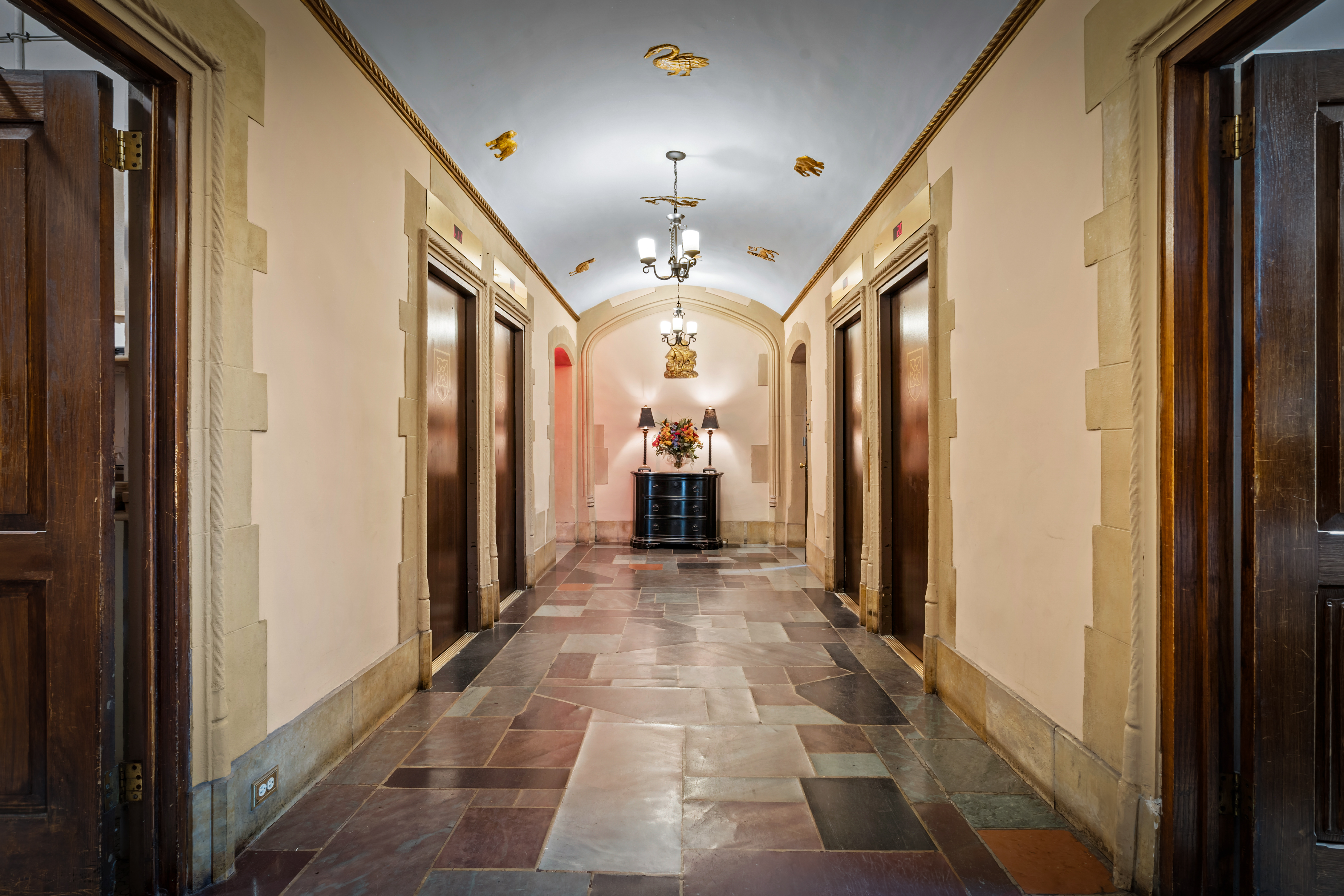45 Tudor City Place, Unit 1708 Manhattan, NY 10017 - Photo 10 of 14 a view of a hallway with wooden floor and staircase