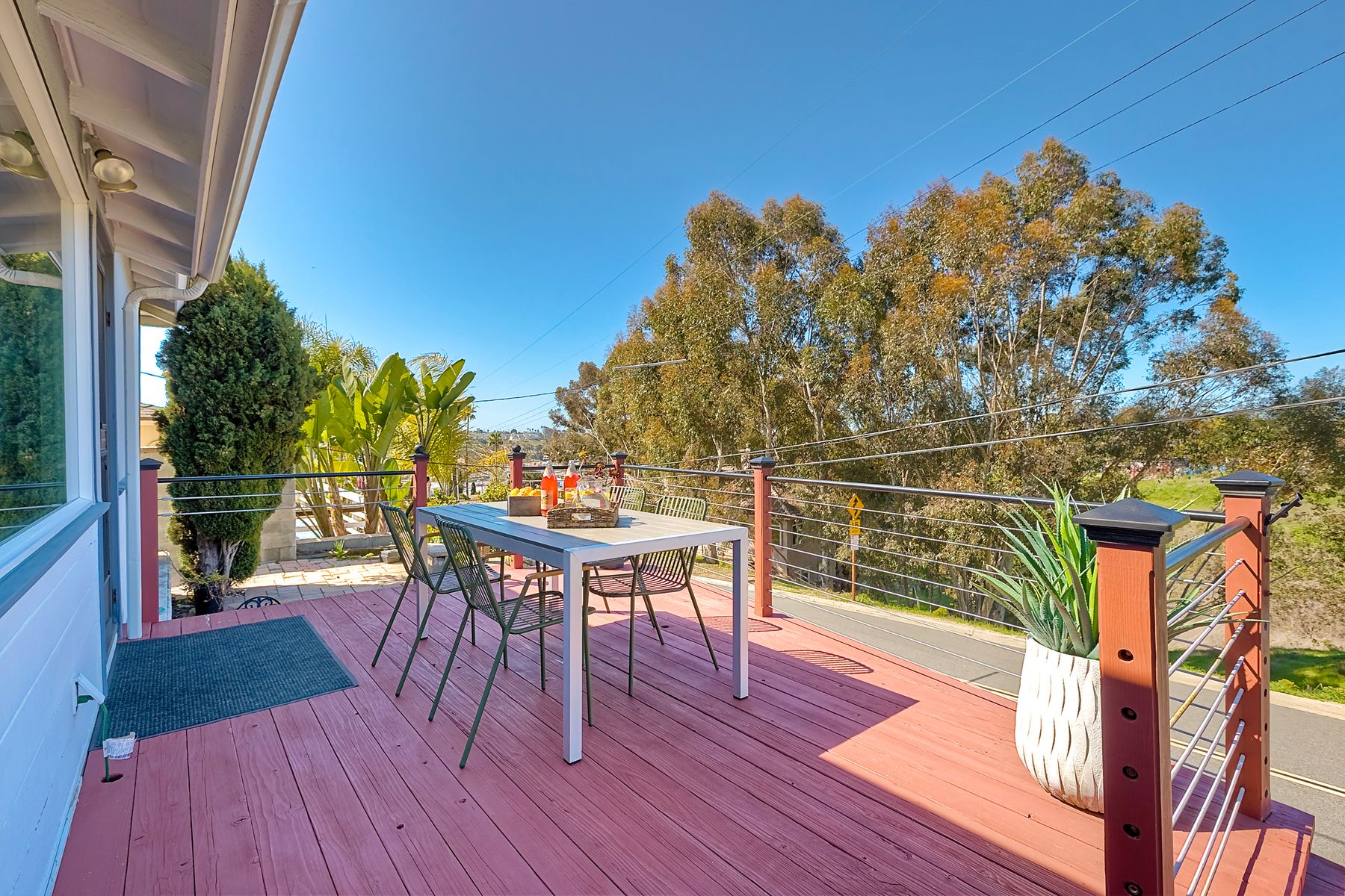 534 Hoover Street Oceanside, CA 92054 - Photo 2 of 31 a view of a chairs and table on the wooden deck