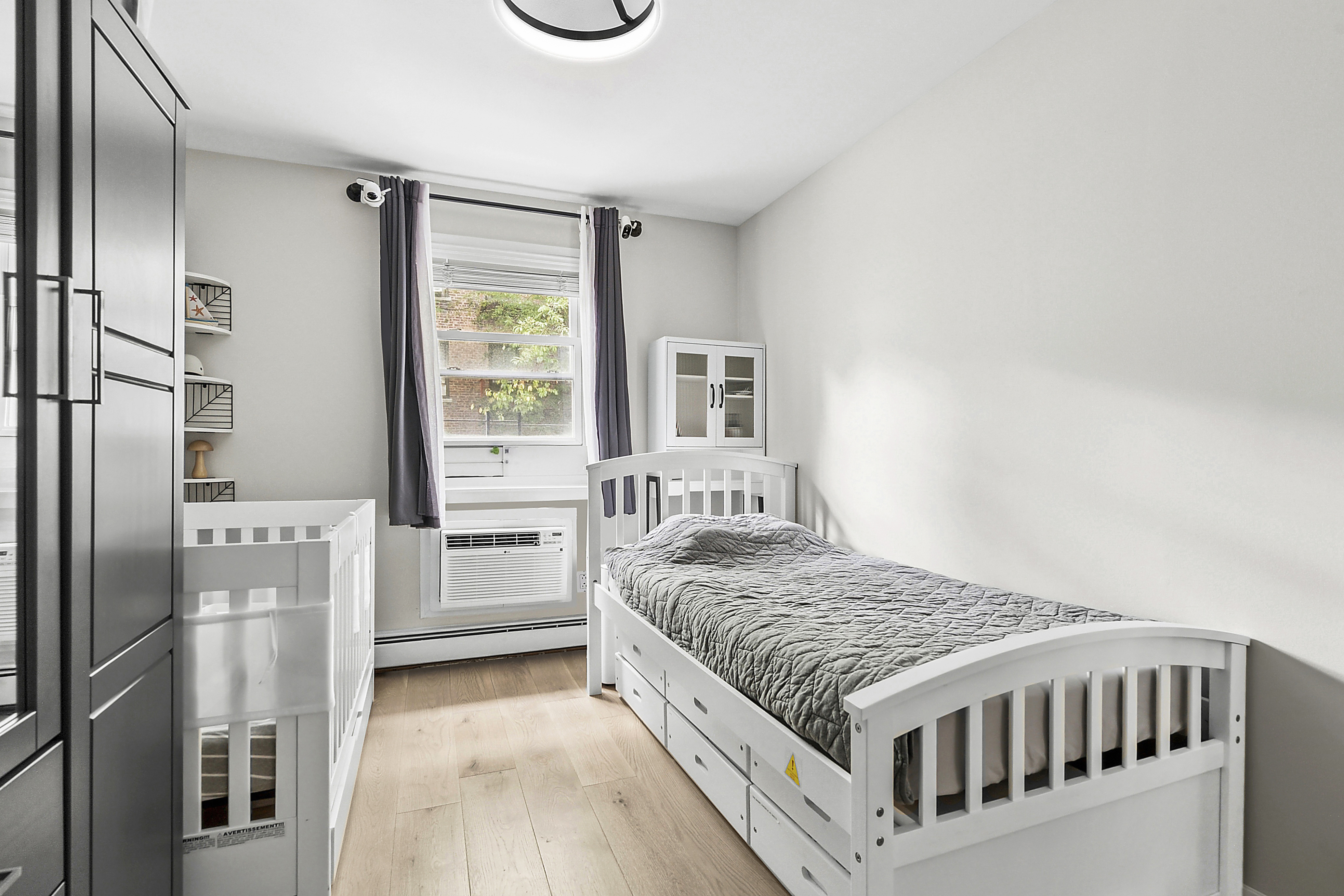 143 Bay Ridge Parkway, Unit 3 Brooklyn, NY 11209 - Photo 8 of 12 a bedroom with a bed and a window