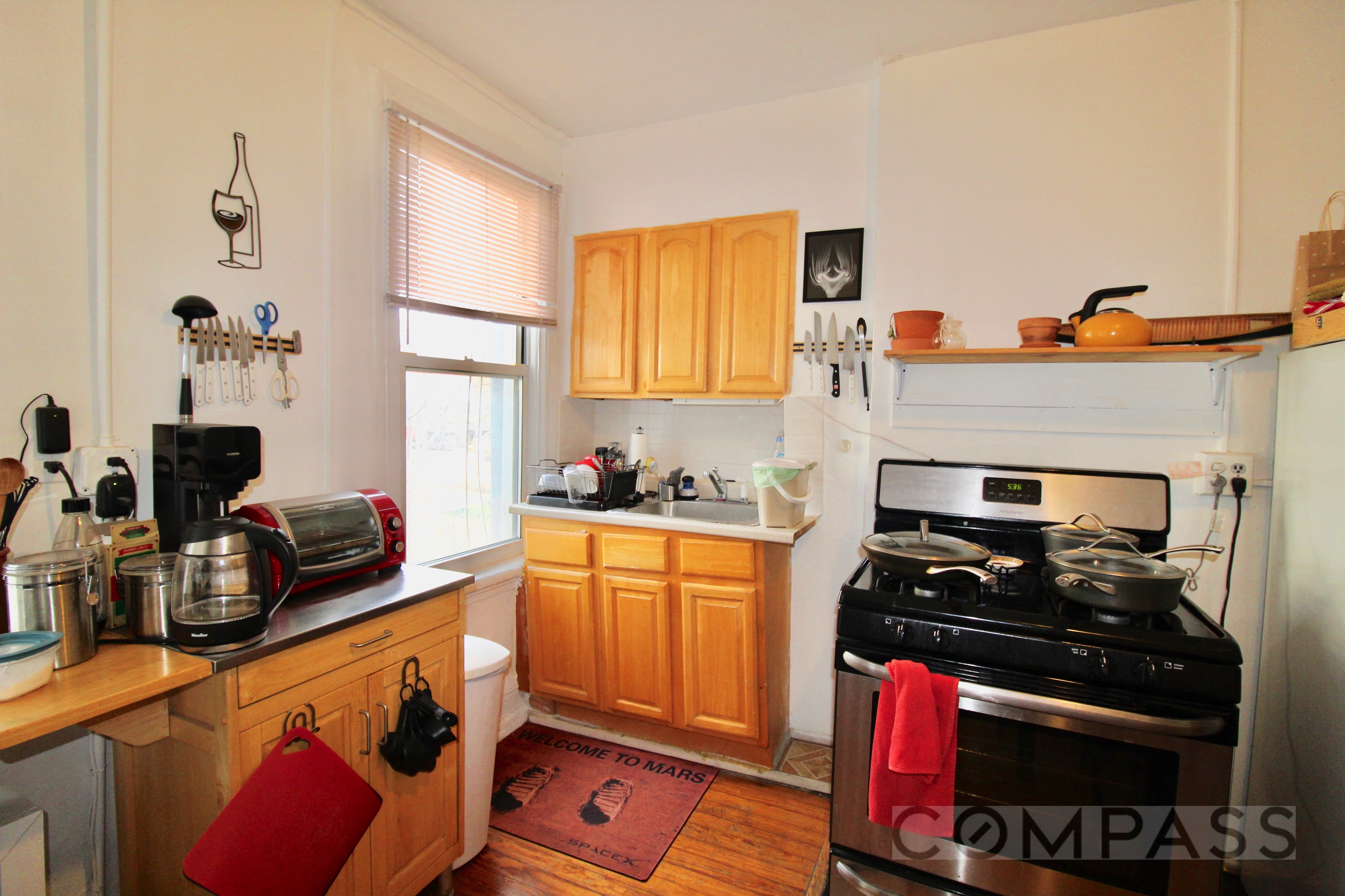 53 Duffield Street, Unit 3 Brooklyn, NY 11201 - Photo 8 of 11 a kitchen with a stove a sink and a microwave
