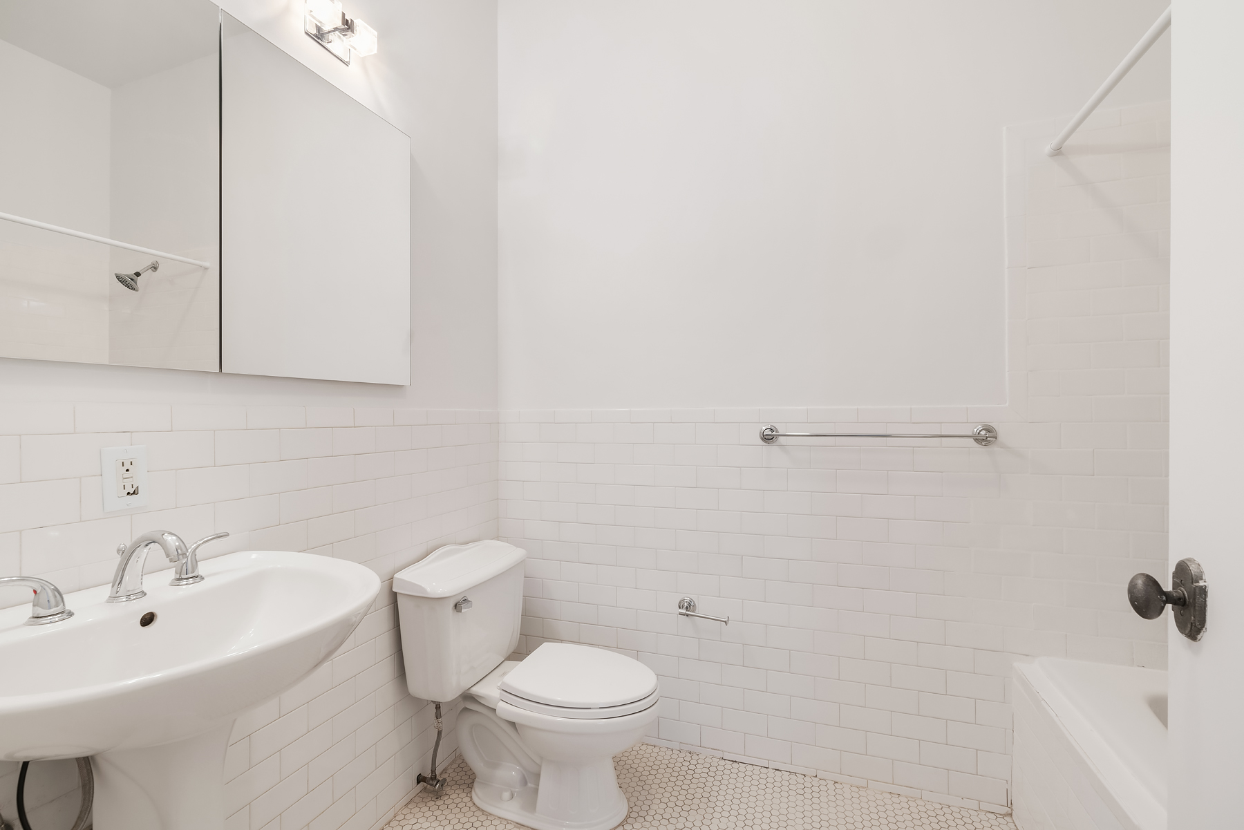 689 Myrtle Avenue, Unit 4E Brooklyn, NY 11205 - Photo 15 of 21 a bathroom with a sink a toilet and shower