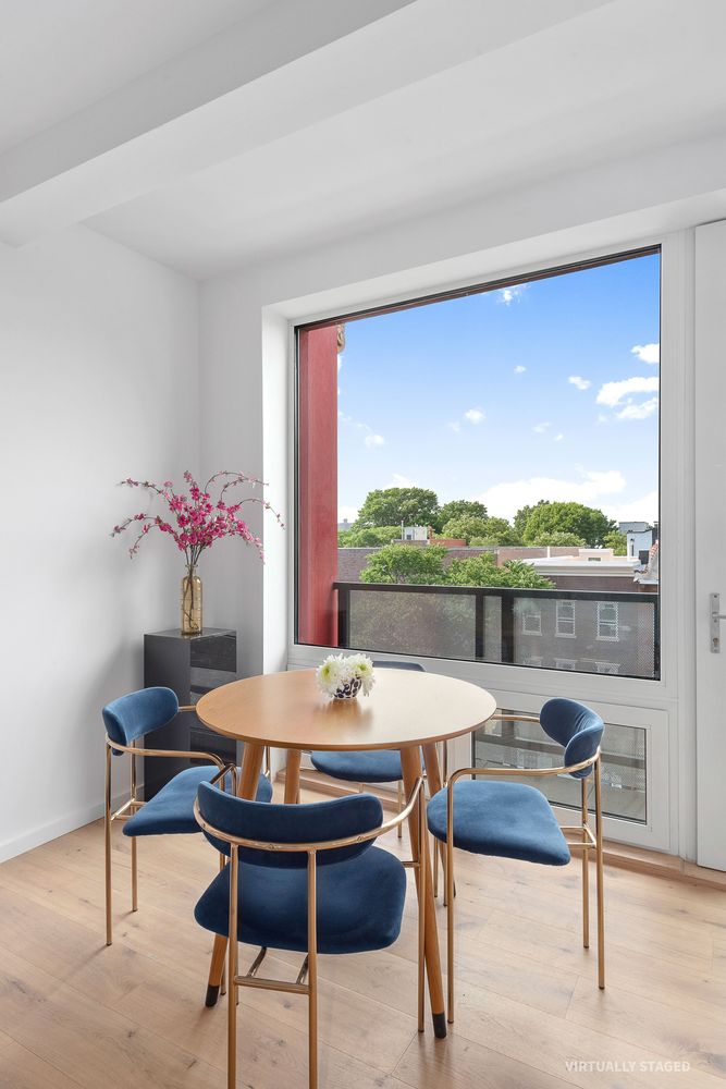 702 Hancock Street, Unit 3A Brooklyn, NY 11233 - Photo 4 of 12 a view of a dining room with furniture window and outside view
