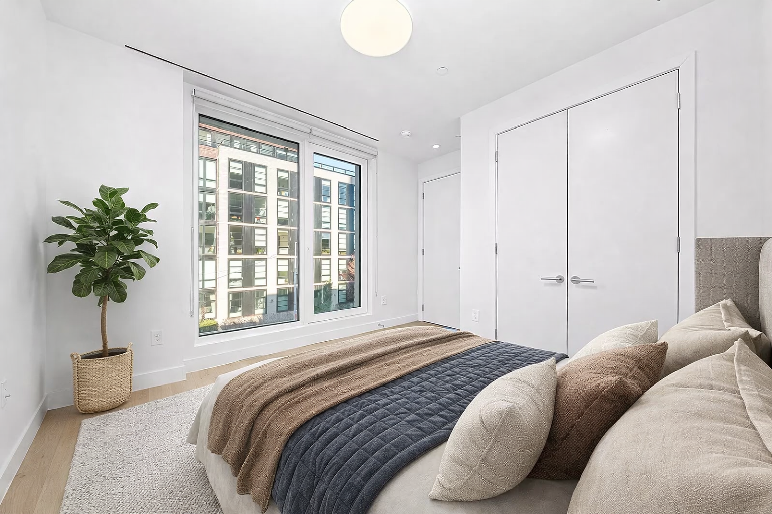130 2nd Street, Unit TH1 Brooklyn, NY 11231 - Photo 6 of 23 a bedroom with a bed and a potted plant