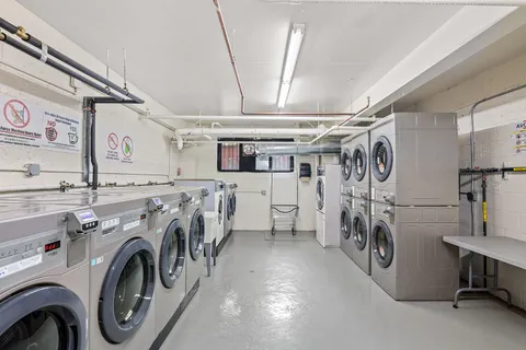 a view of a storage and utility room with lots of racks
