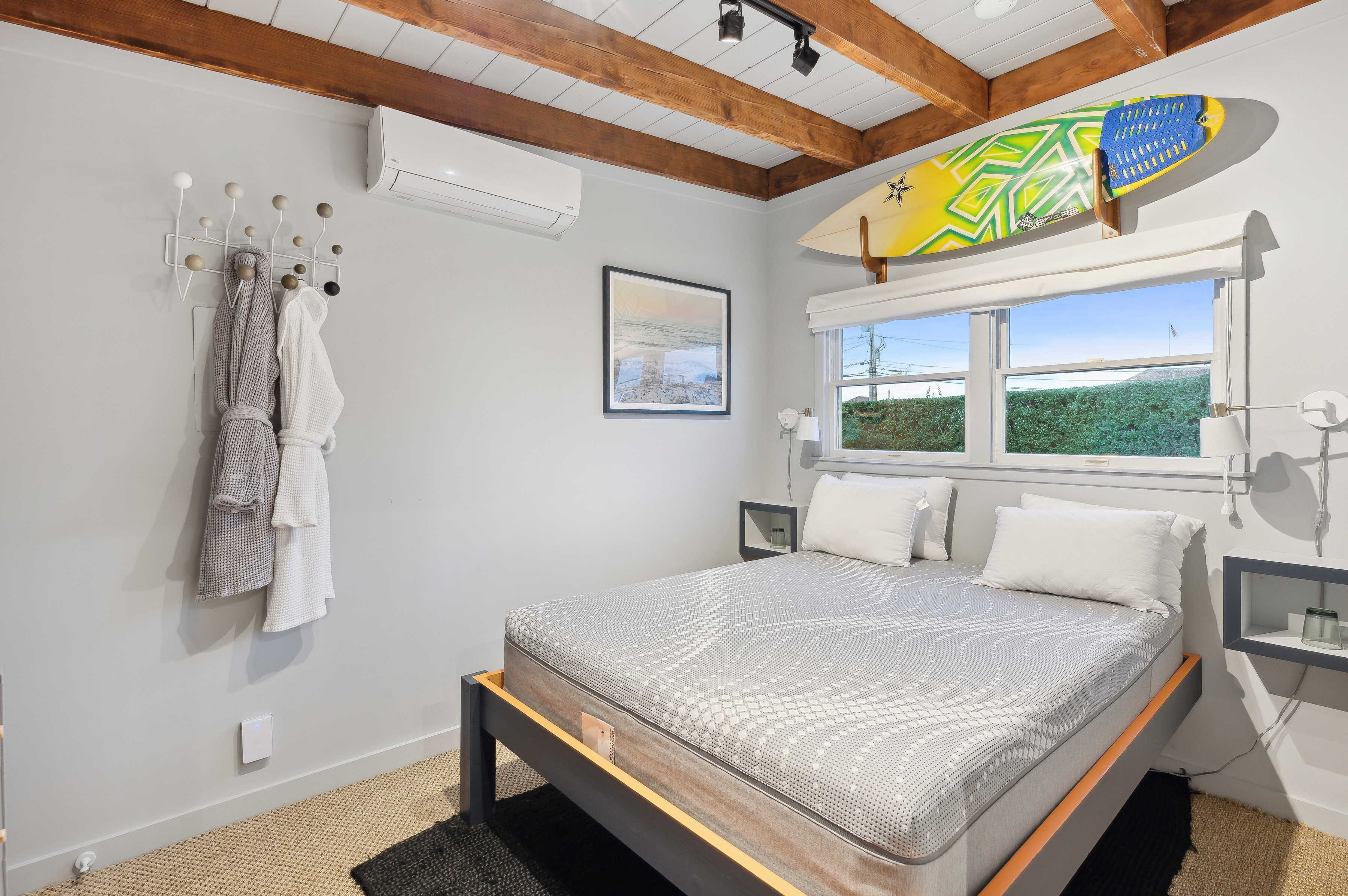 32 Lighthouse Road Hampton Bays, NY 11946 - Photo 47 of 51 a bedroom with a bed and a window