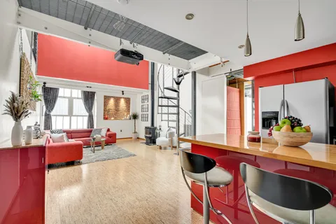 a kitchen with stainless steel appliances granite countertop a refrigerator and a stove