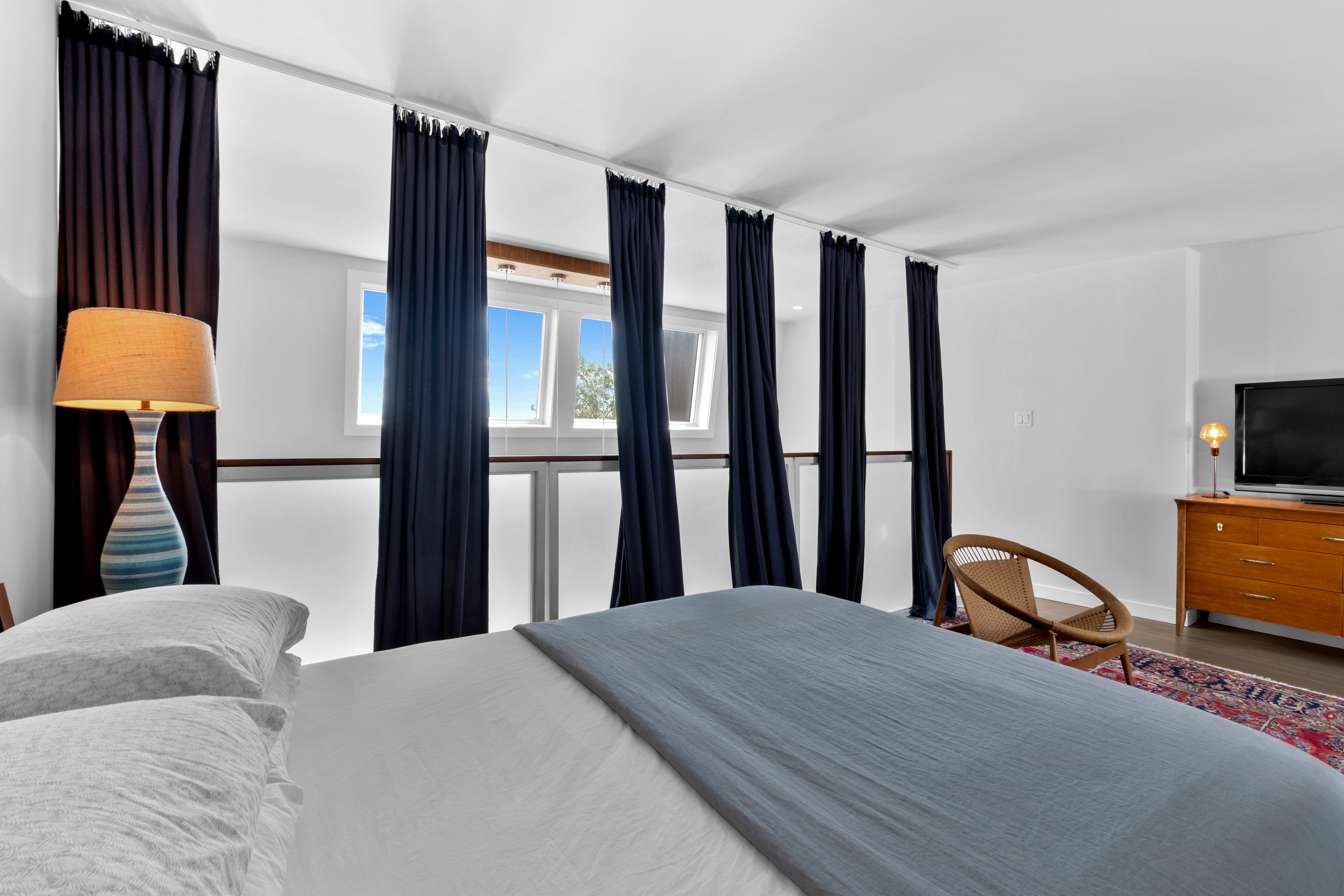 256 1/2 South 3rd Street Philadelphia, PA 19106 - Photo 41 of 73 a bedroom with a bed and a lamp