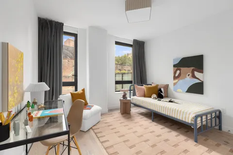 a room with a bed and a window