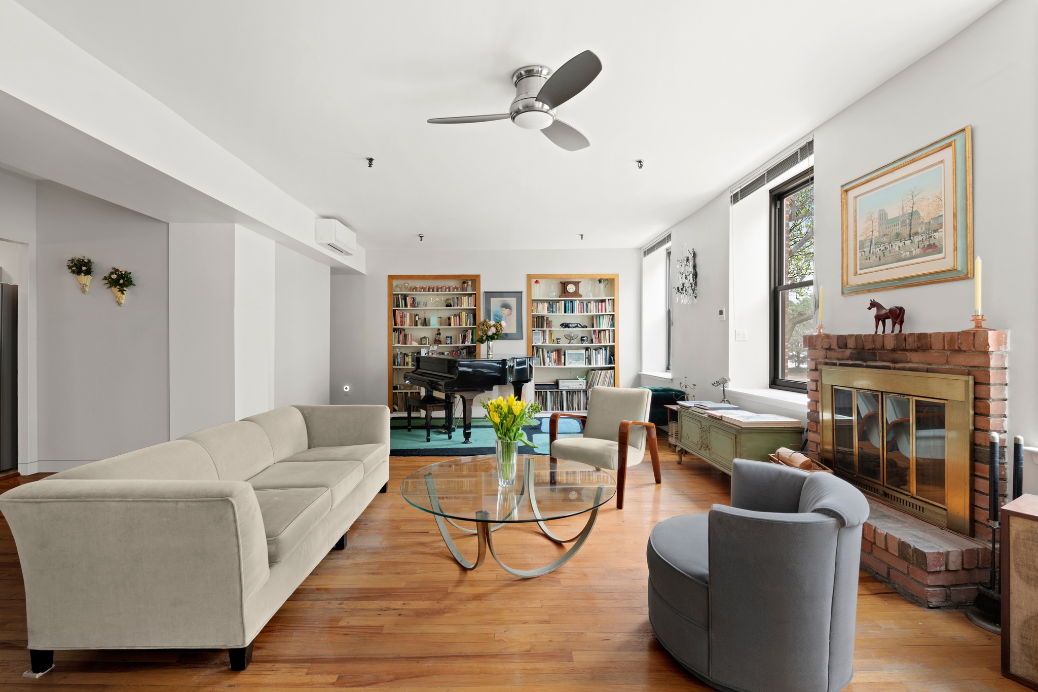 166 Bank Street, Unit LOFT2C Manhattan, NY 10014 - Photo 3 of 11 a living room with furniture and a fireplace