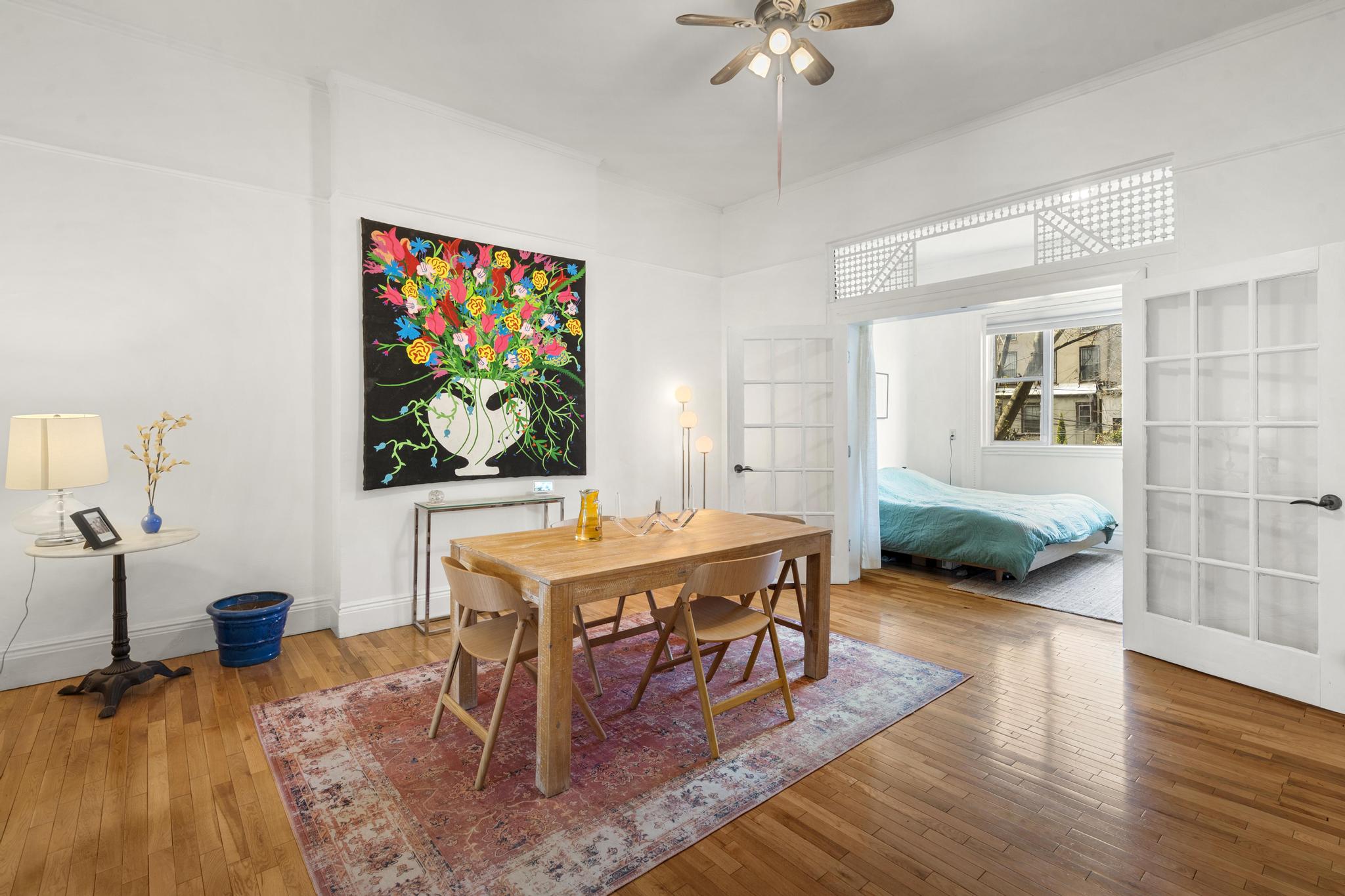364 Clermont Avenue Brooklyn, NY 11238 - Photo 4 of 18 a living room with dining room and wooden floor