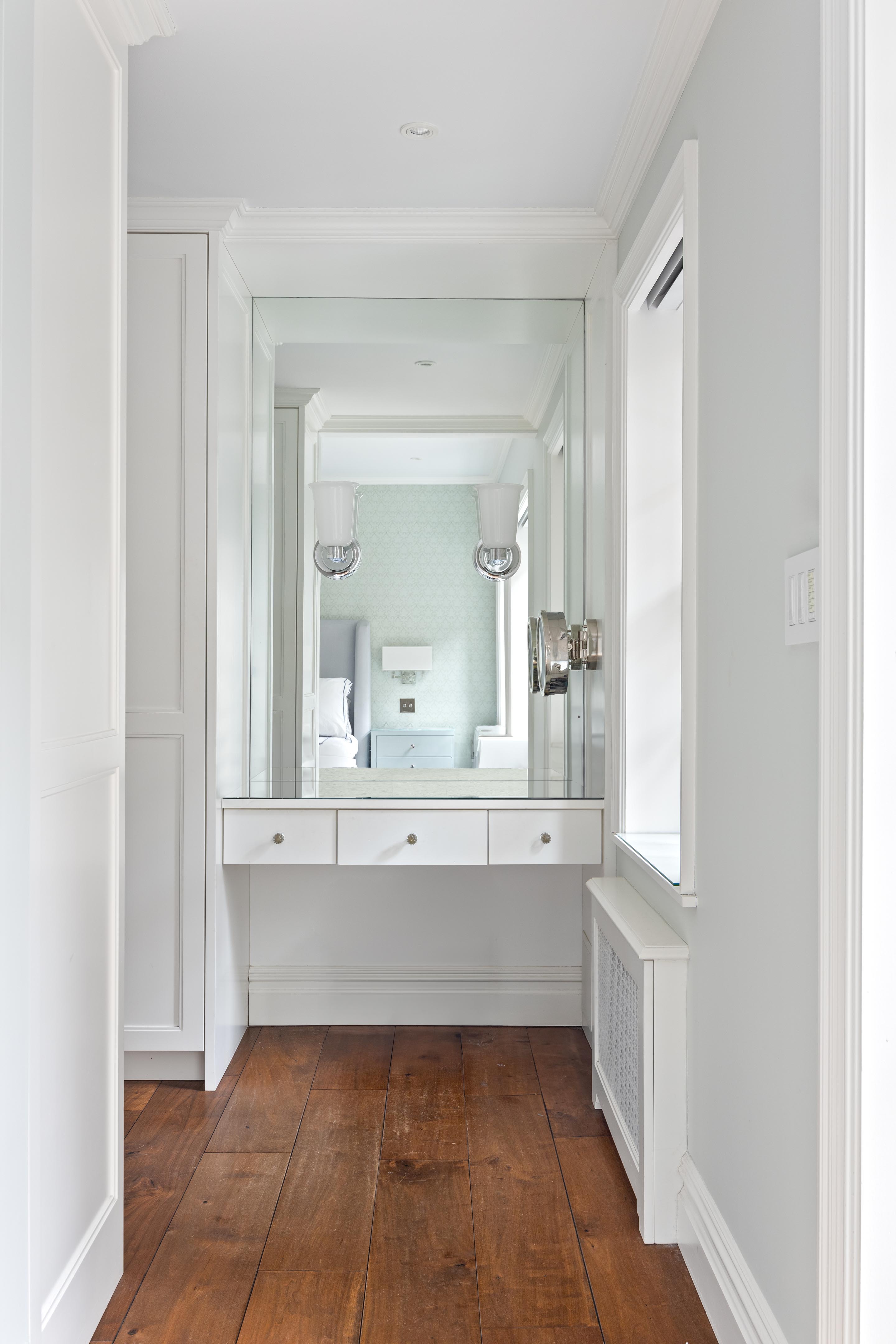 14 West 11th Street, Unit GARDEN Manhattan, NY 10011 - Photo 8 of 18 a bathroom with a bathtub sink and mirror