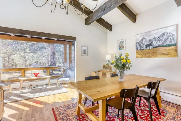 a view of a living room a window and wooden floor