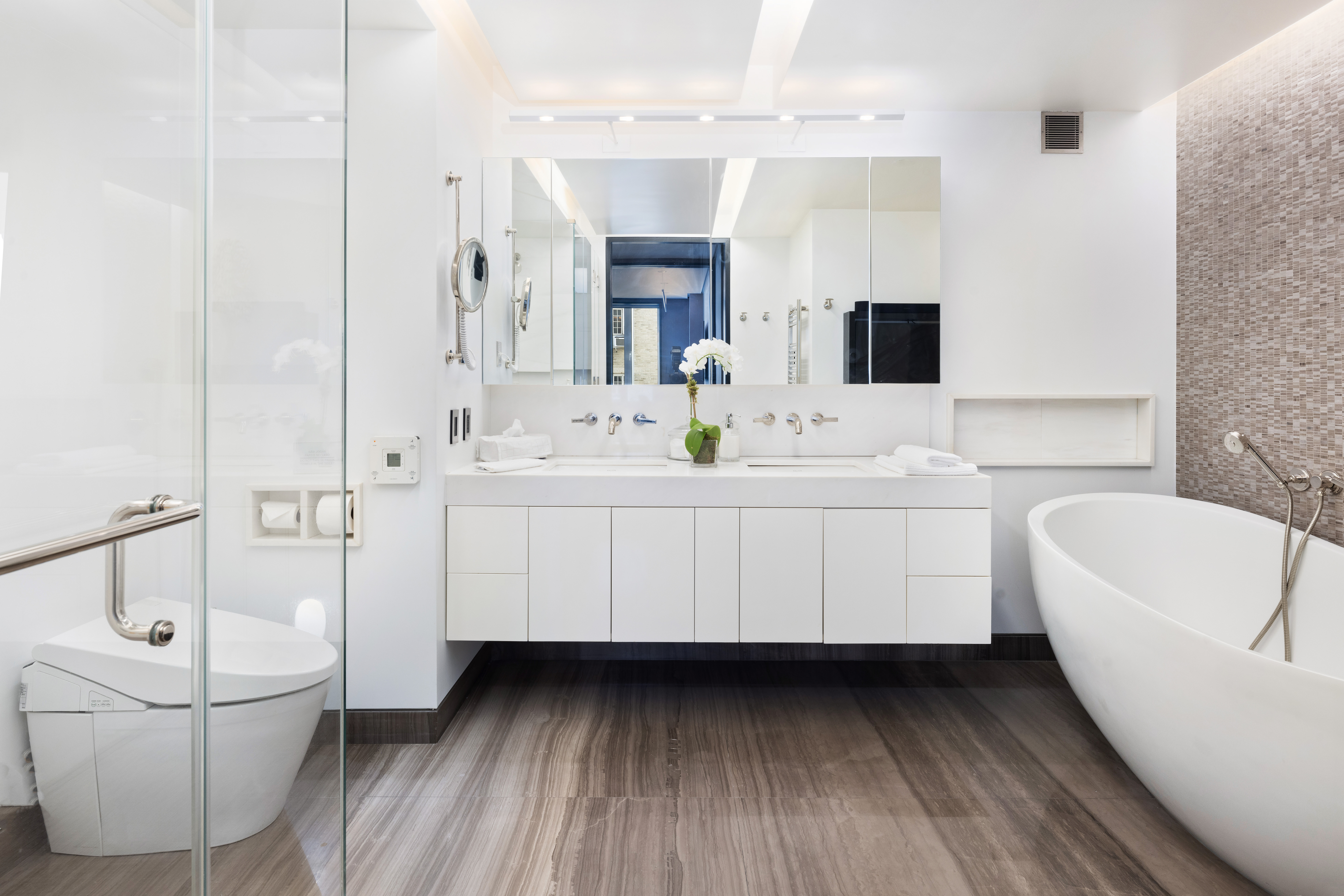 279 Central Park West, Unit 8BC Manhattan, NY 10024 - Photo 13 of 20 a bathroom with a double vanity sink a mirror and a bathtub