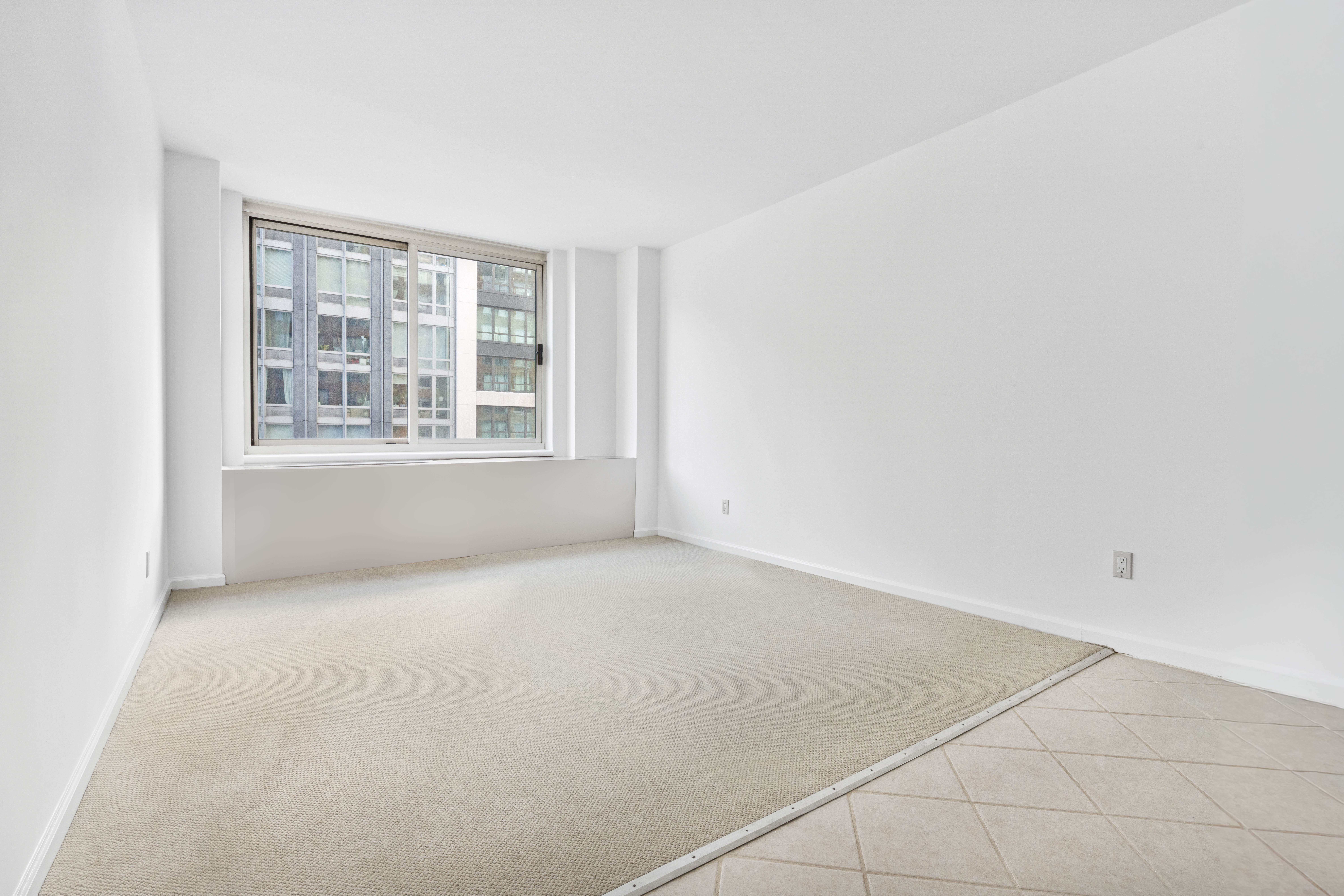 201 West 72nd Street, Unit 8A Manhattan, NY 10023 - Photo 9 of 15 an empty room with a window