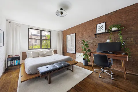 a living room with furniture rug and a window