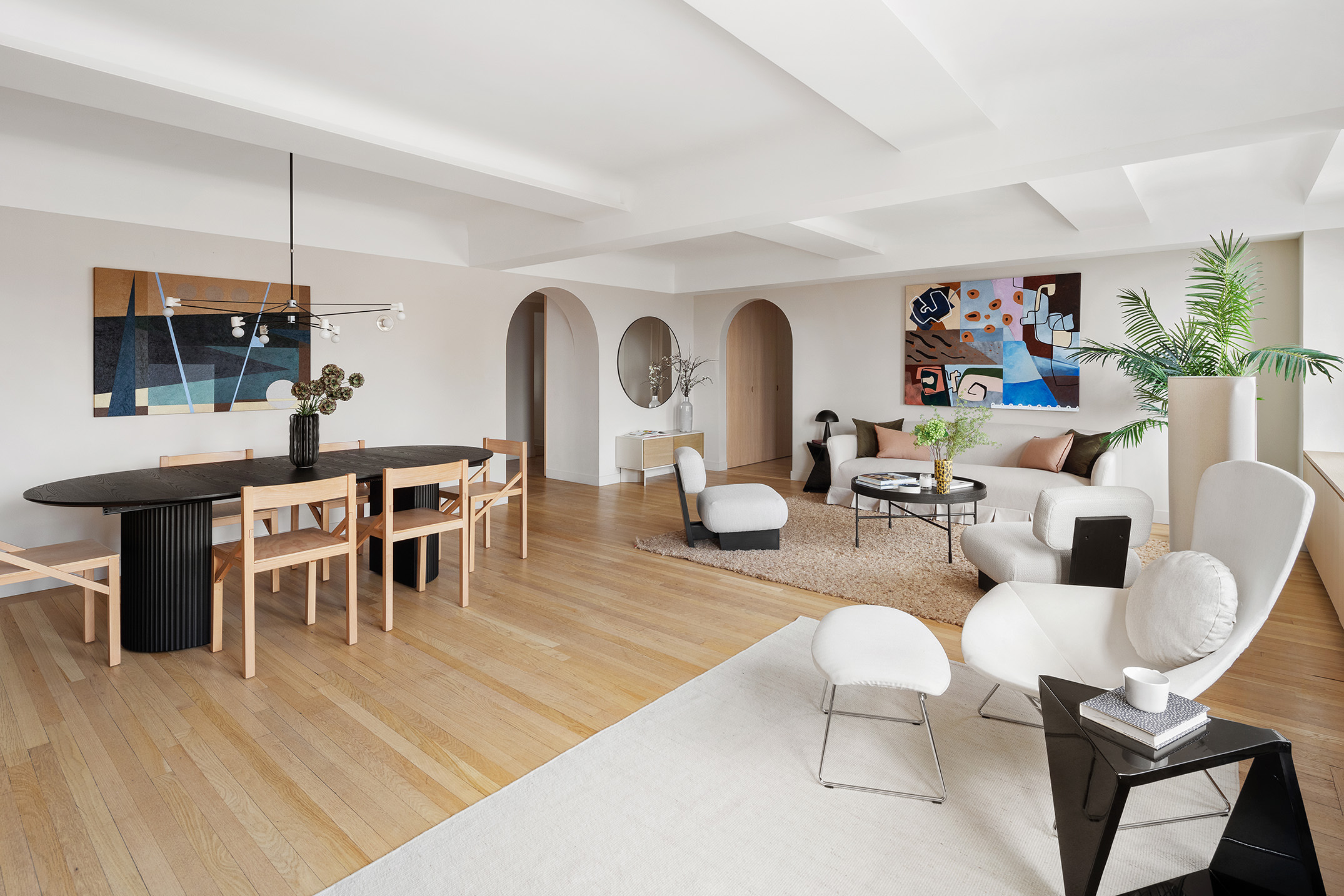 425 East 86th Street, Unit 11E Manhattan, NY 10028 - Photo 14 of 19 a living room with furniture a flat screen tv and kitchen view