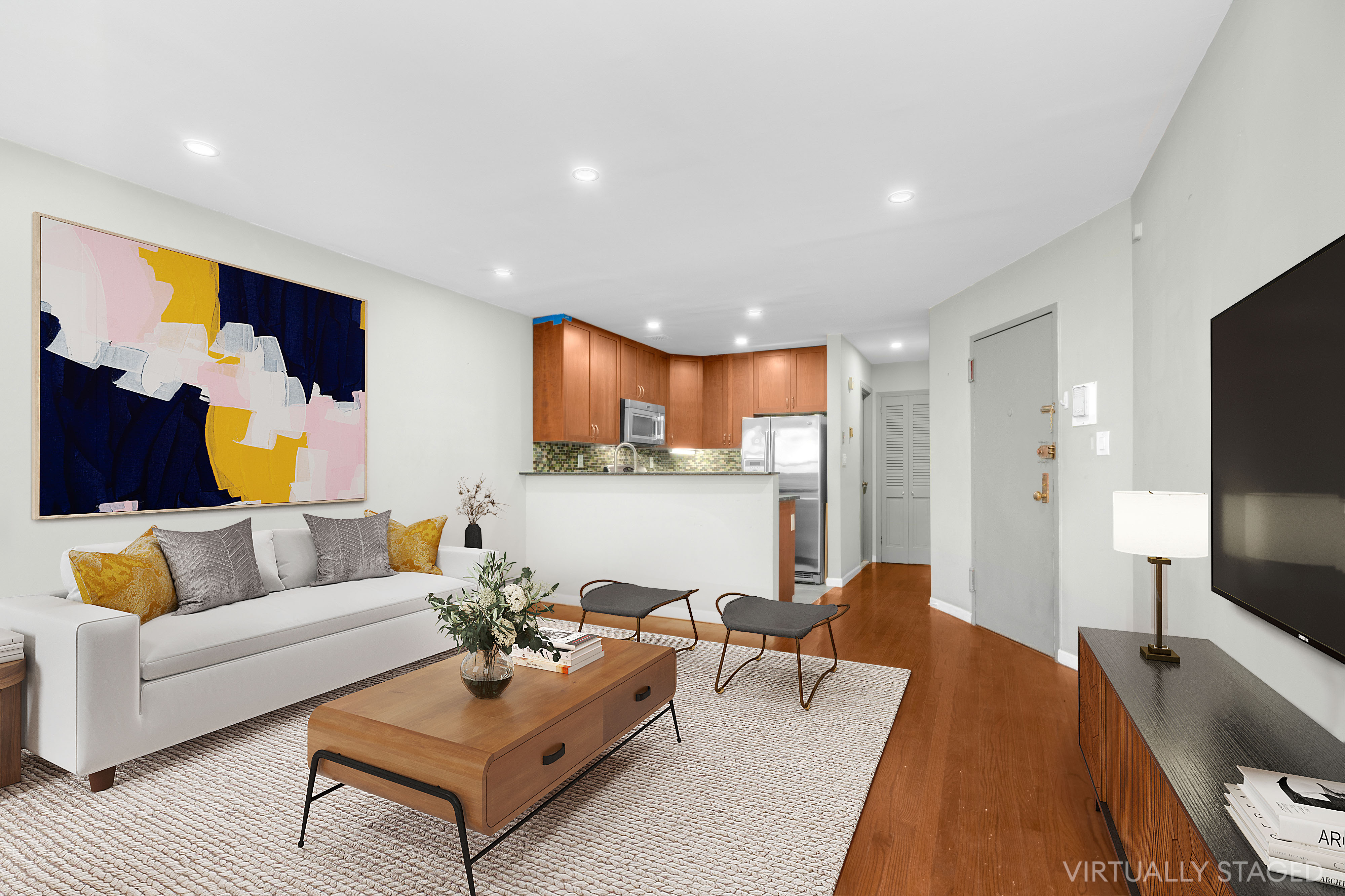 a living room with furniture and a flat screen tv