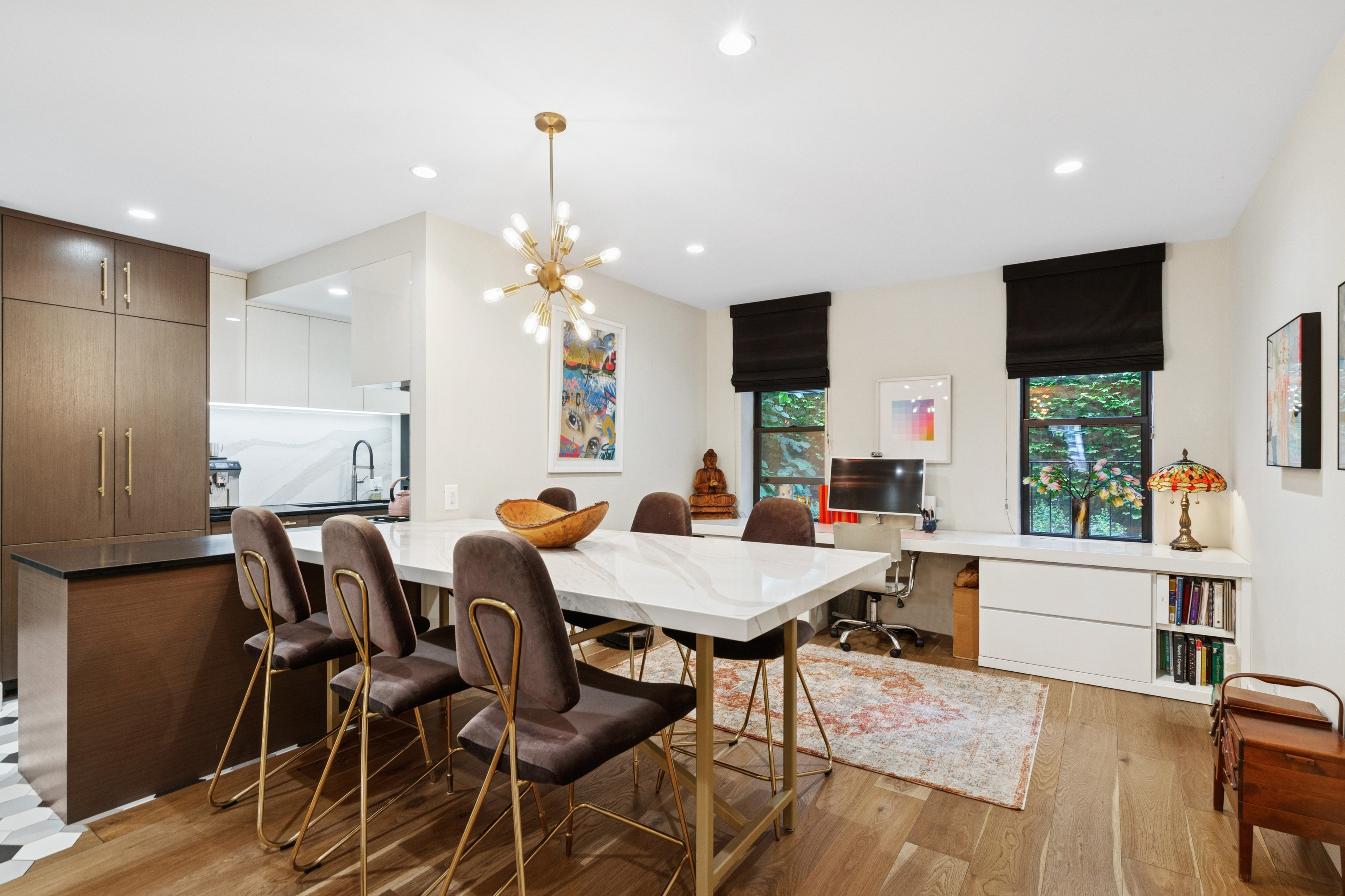 125 Cabrini Boulevard, Unit A22 Manhattan, NY 10033 - Photo 5 of 20 a view of a dining room with furniture and a chandelier